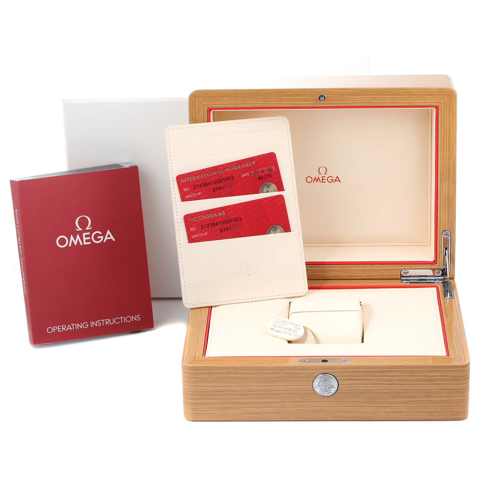 The image shows the open box of an Omega Seamaster 212.30.41.20.01.003 Men
s Stainless Steel Black Dial 212.30.41.20.01.003 Men
s Stainless Steel Black Dial watch, along with its operating instructions and warranty cards.