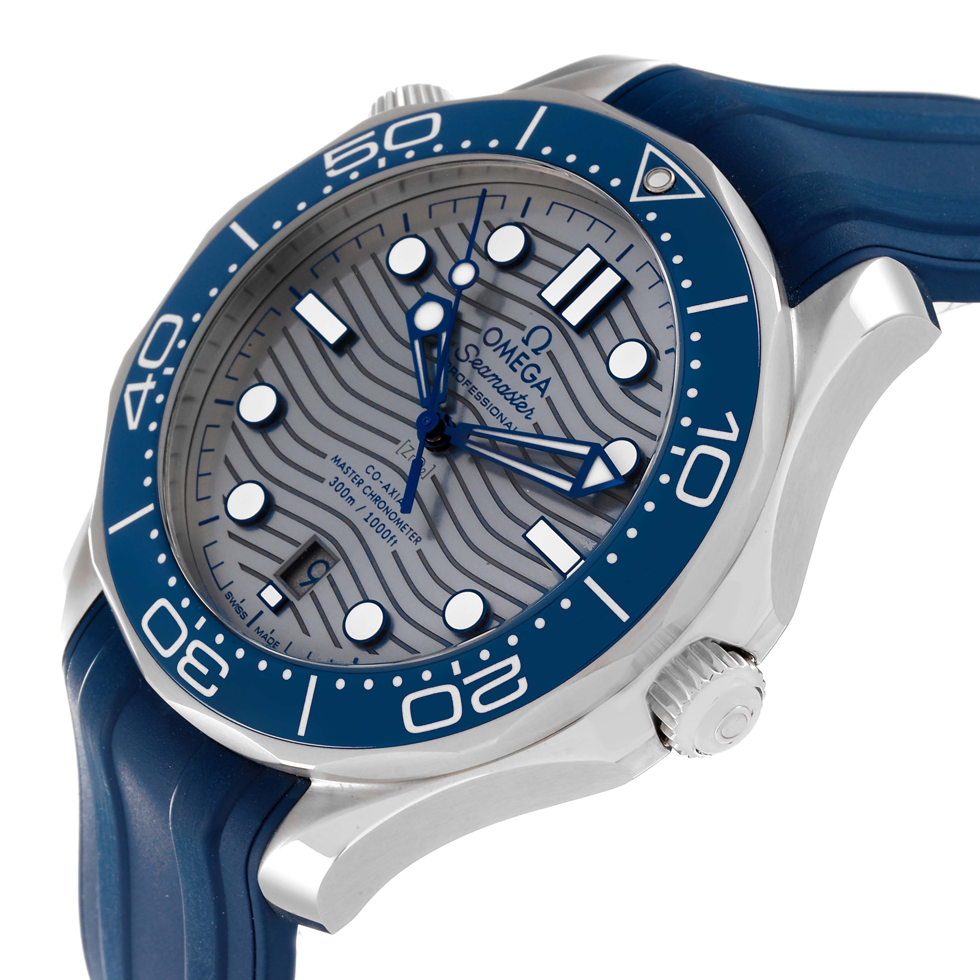 The image shows an angled view of the Omega Seamaster 210.32.42.20.06.001 Men's Stainless Steel Grey Dial 210.32.42.20.06.001 Men's Stainless Steel Grey Dial watch, highlighting its blue bezel, crown, and wavy-patterned dial.