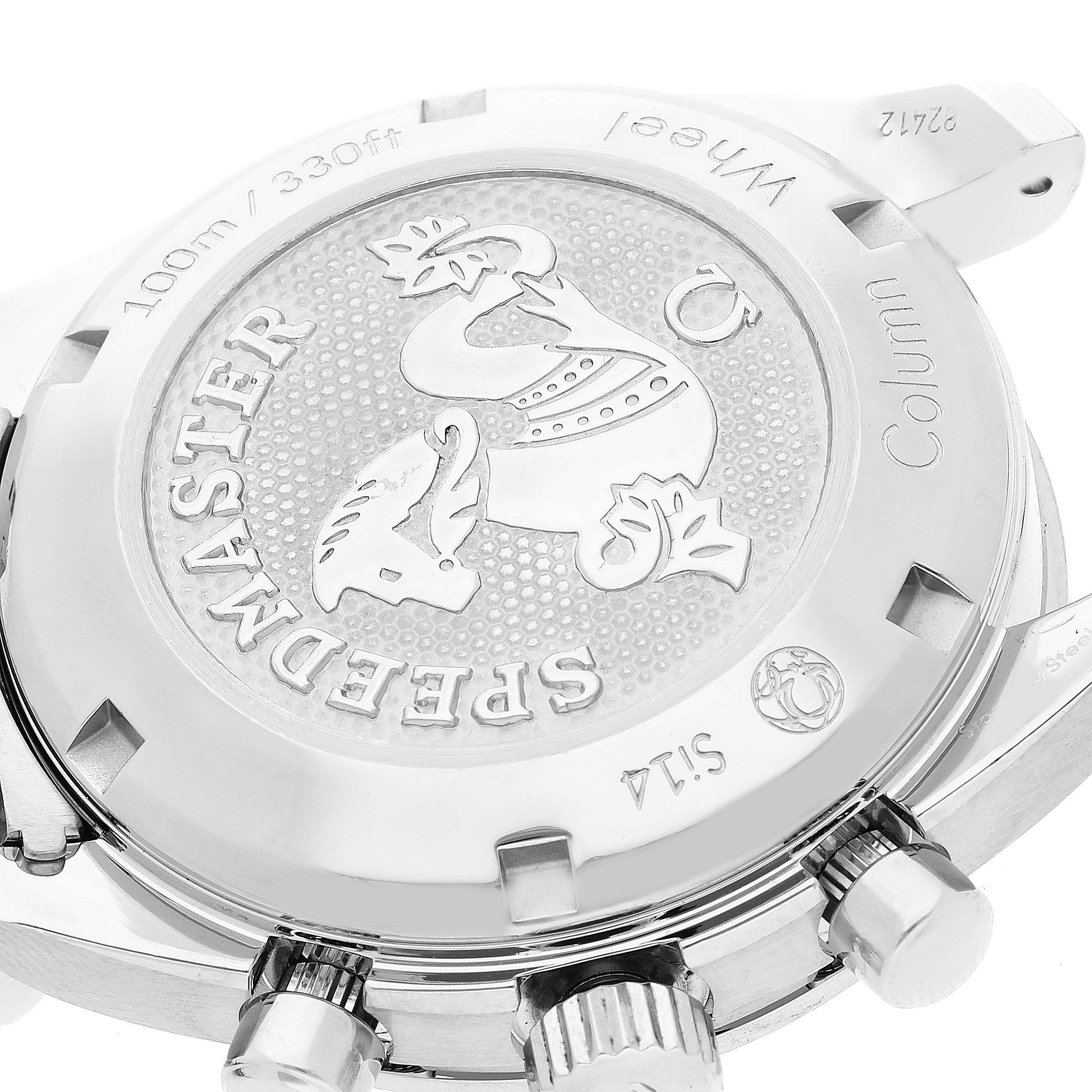 The image shows the back case of an Omega Speedmaster 324.30.38.50.03.001 Men's Stainless Steel Blue Dial 324.30.38.50.03.001 Men's Stainless Steel Blue Dial watch, highlighting its engraved design and labeling.