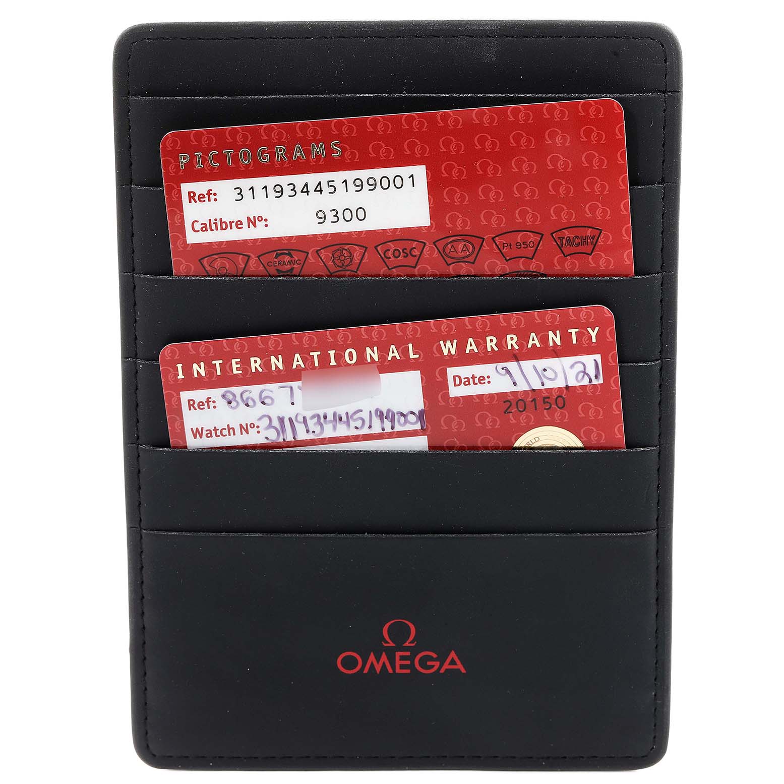 The image shows a black Omega cardholder containing warranty and pictograms cards for an Omega Speedmaster 311.93.44.51.99.001 Men's Ceramic Silver Dial 311.93.44.51.99.001 Men's Ceramic Silver Dial watch.