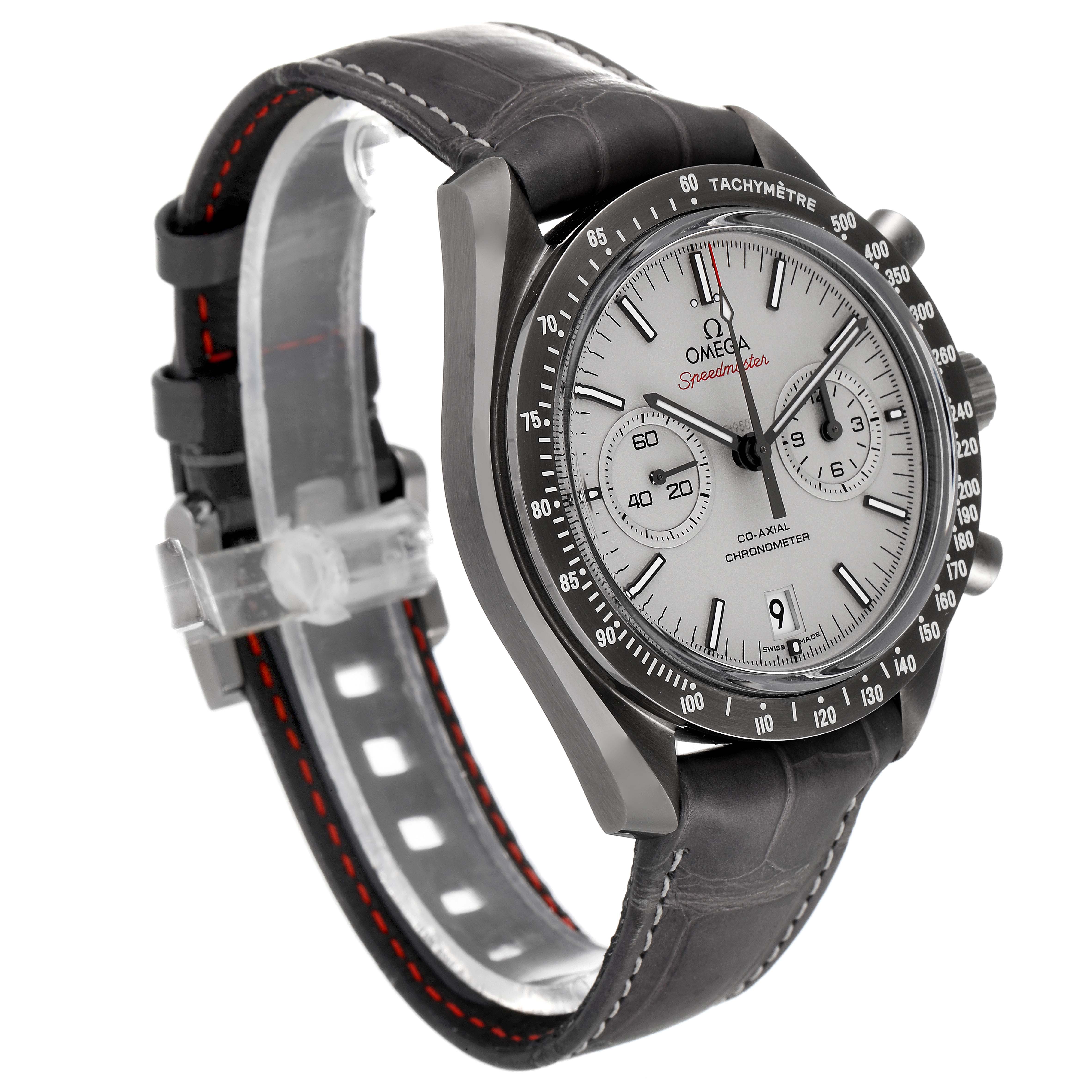 The Omega Speedmaster 311.93.44.51.99.001 Men's Ceramic Silver Dial 311.93.44.51.99.001 Men's Ceramic Silver Dial watch is shown in a three-quarter angle, highlighting the dial, bezel, and leather strap with red stitching.