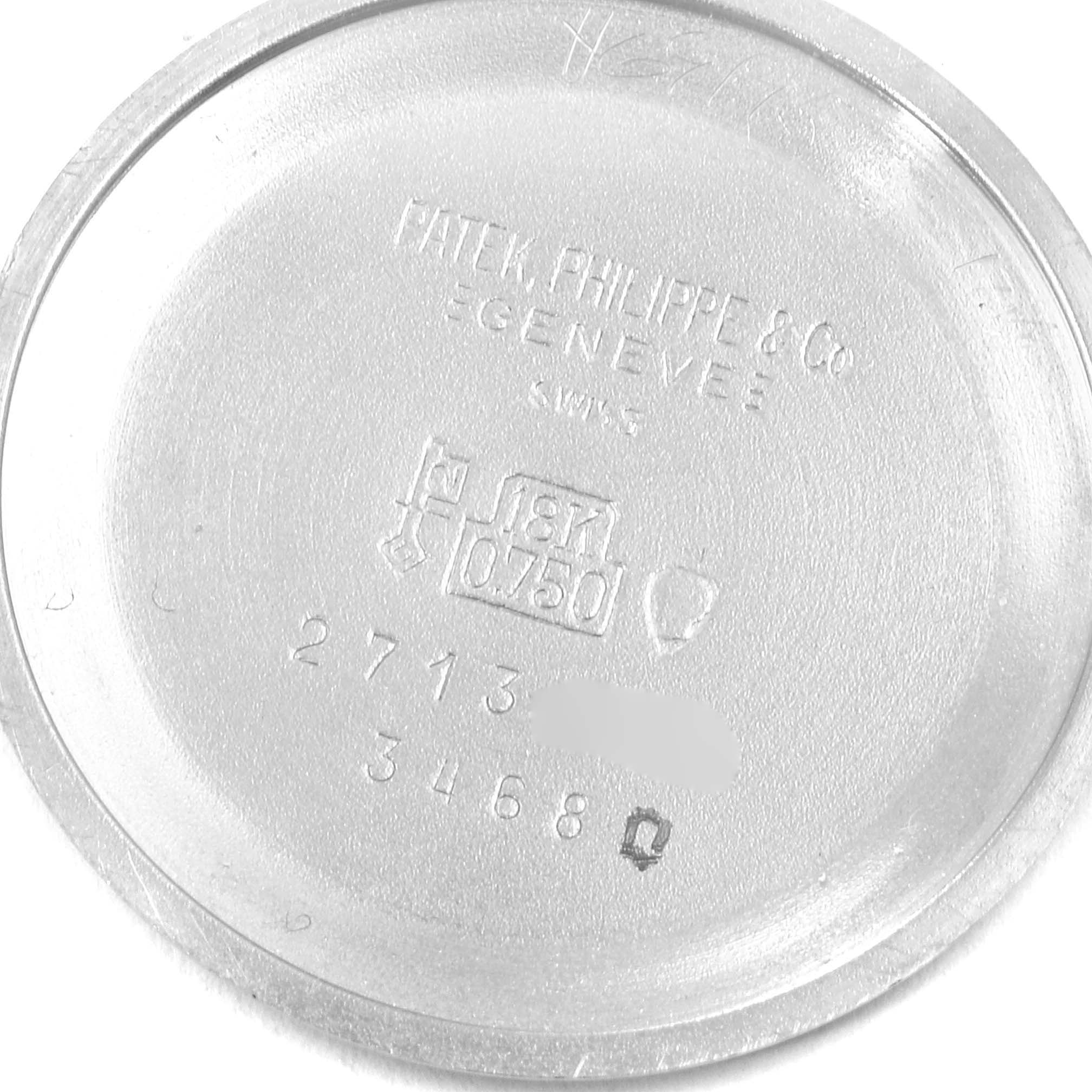 This image shows the inner case back of a Vintage Patek Philippe watch, displaying engravings and hallmarks.