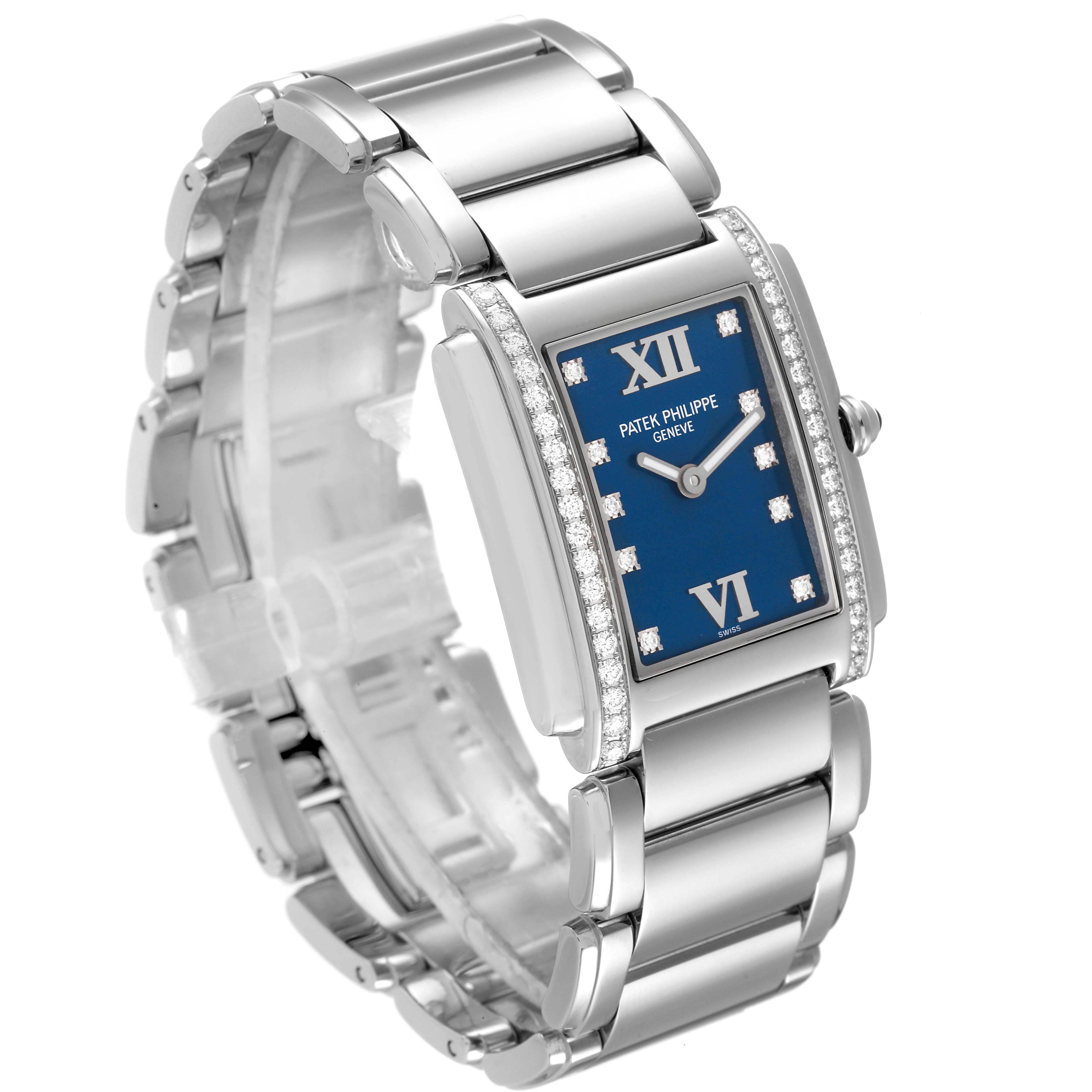 The image shows a side angle of the Patek Philippe Twenty-4 4910-10A-012 Women's Stainless Steel Blue Dial 4910-10A-012 Women's Stainless Steel Blue Dial watch, highlighting its blue dial, Roman numerals, and diamond bezel.
