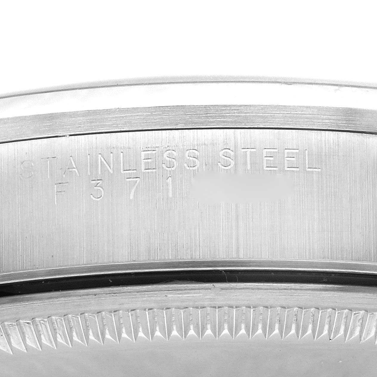 The image shows a close-up of the caseback edge with engravings on a Rolex Air-King 14000M Men's Stainless Steel Blue Dial 14000M Men's Stainless Steel Blue Dial watch, emphasizing the stainless steel material.