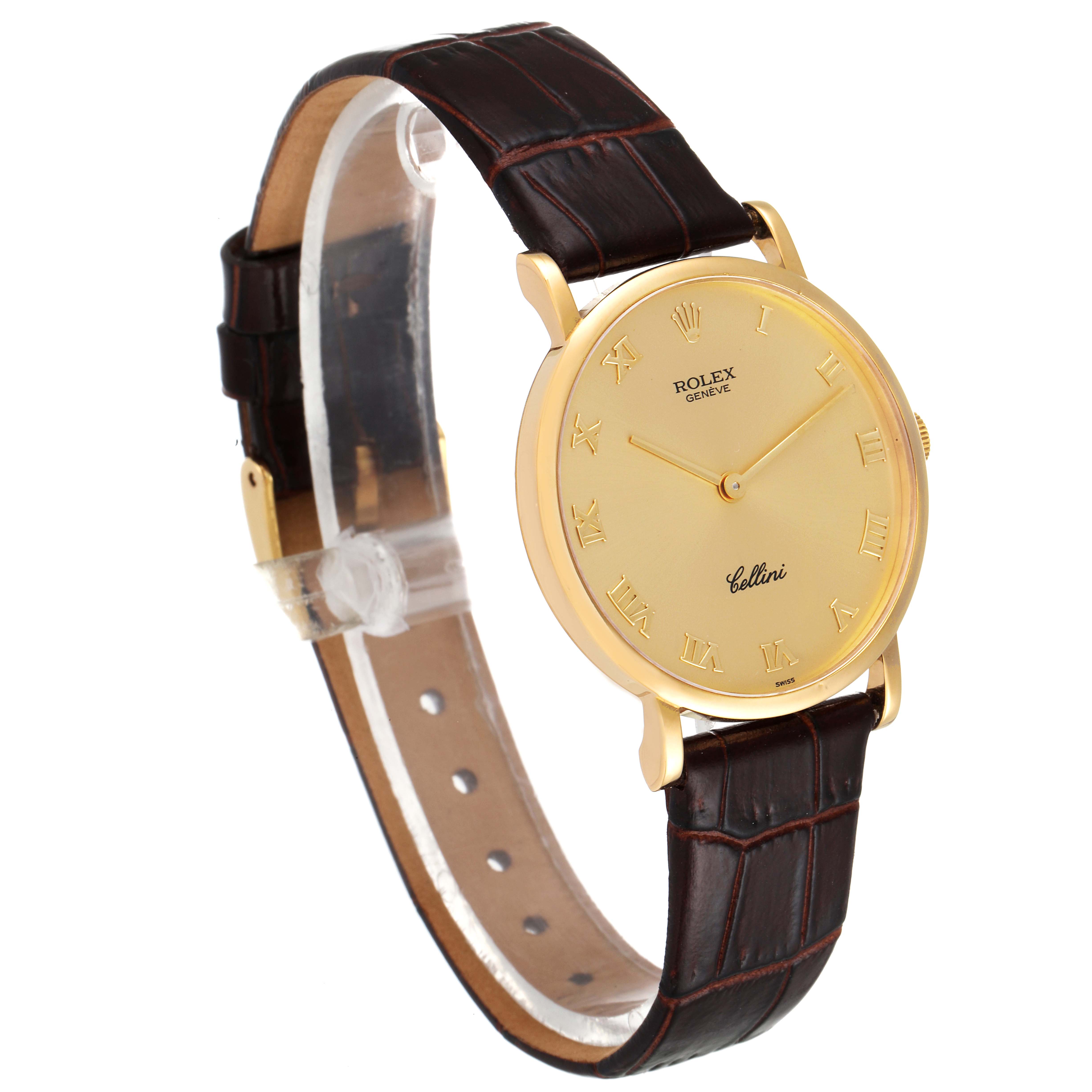 The Rolex Cellini 5112 Men's Yellow Gold Champagne Dial 5112 Men's Yellow Gold Champagne Dial watch is shown at a three-quarter angle, displaying its gold case, roman numeral dial, and brown leather strap.