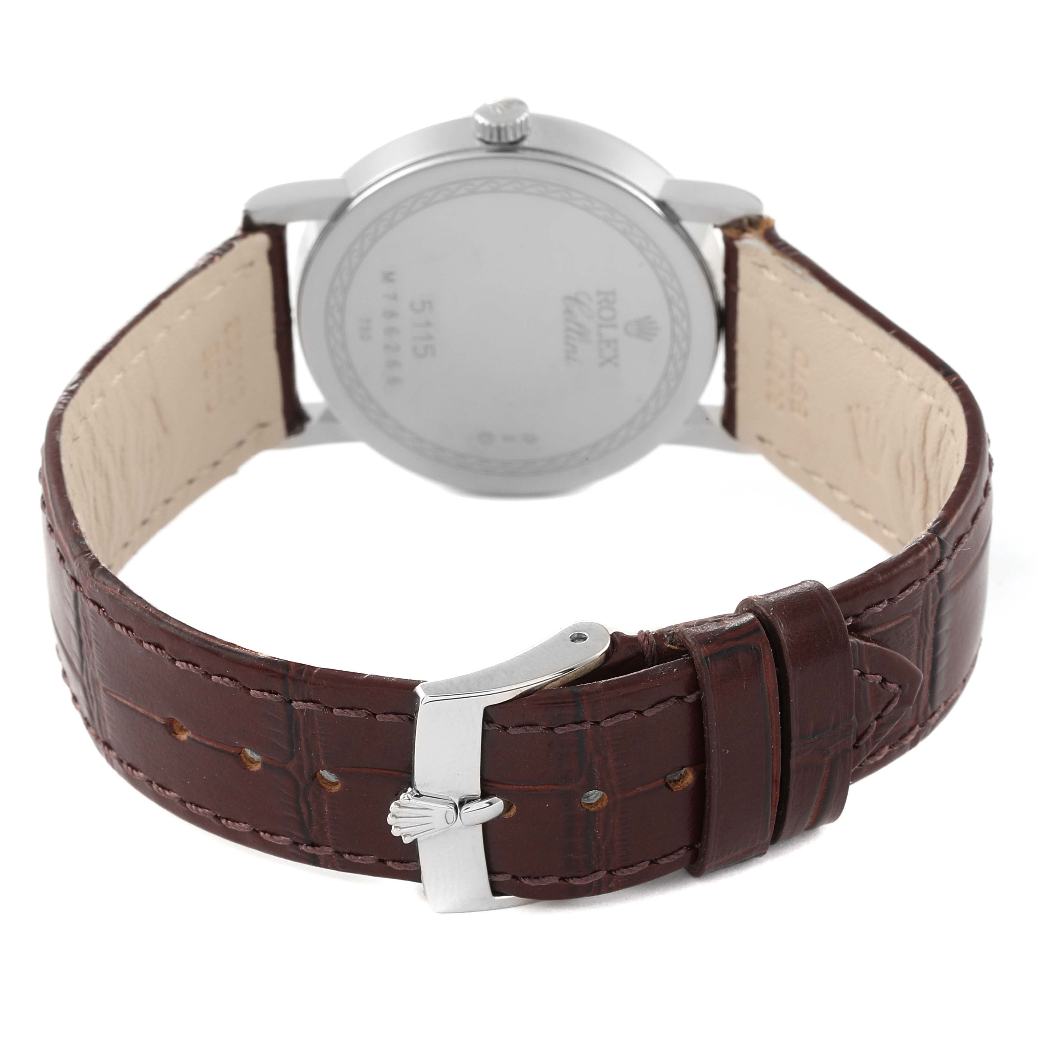 The image shows the back view of the Rolex Cellini 5115 Men's White Gold Mother of Pearl Dial 5115 Men's White Gold Mother of Pearl Dial watch, highlighting its case back, crown, and leather strap with a clasp.