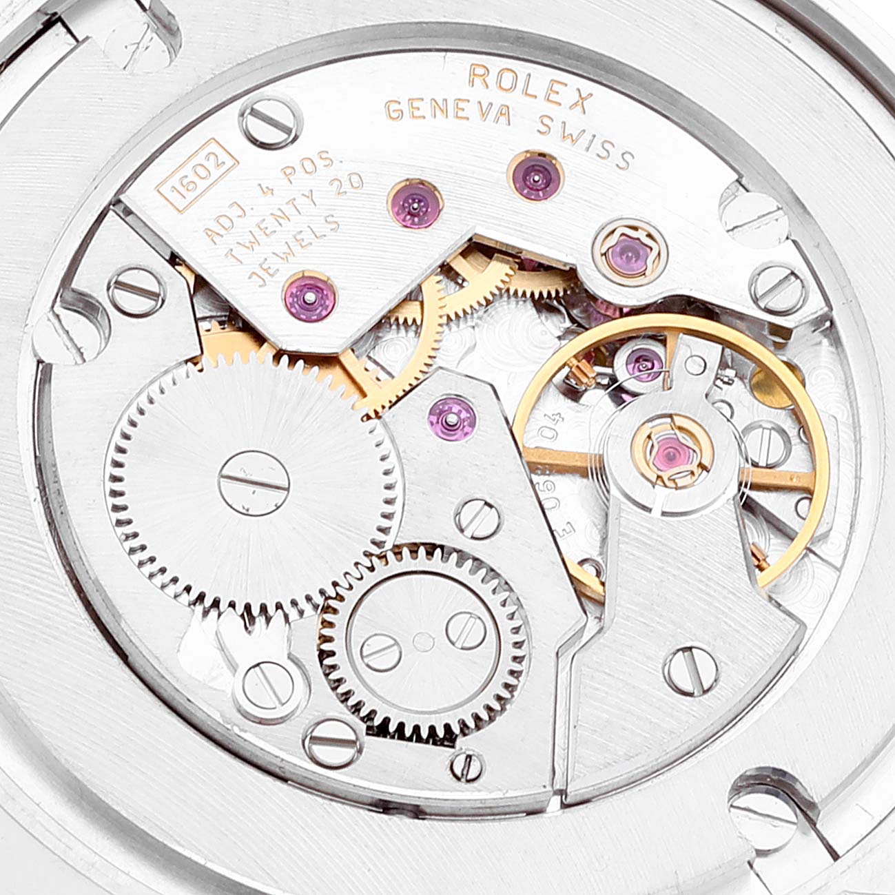 The image shows the intricate internal mechanism of a Rolex Cellini 5115 Men's White Gold Mother of Pearl Dial 5115 Men's White Gold Mother of Pearl Dial watch, focusing on its gears and jewel bearings.