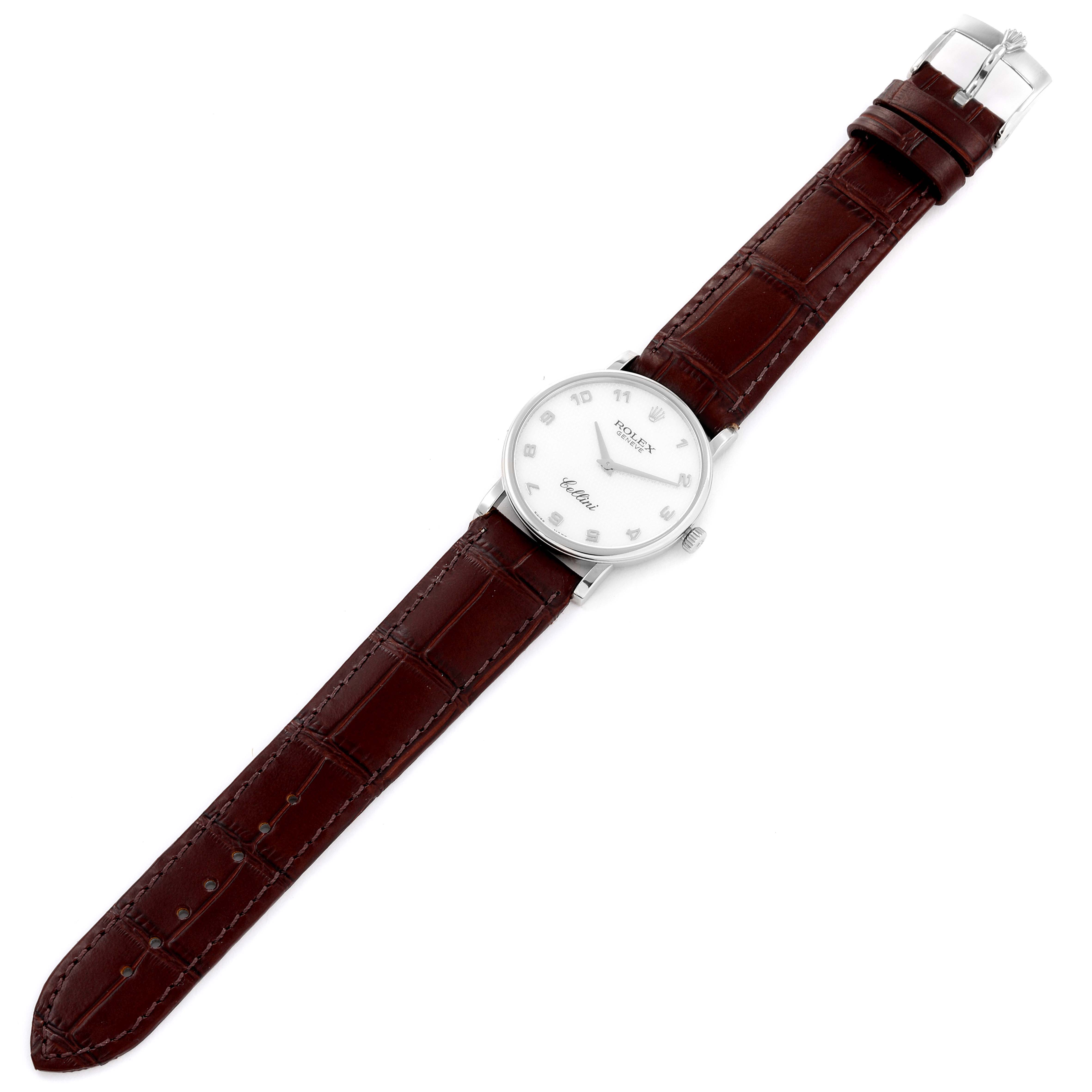 The image shows a Rolex Cellini 5115 Men's White Gold Mother of Pearl Dial 5115 Men's White Gold Mother of Pearl Dial watch from a top-down angle, featuring a brown leather strap and a white dial.