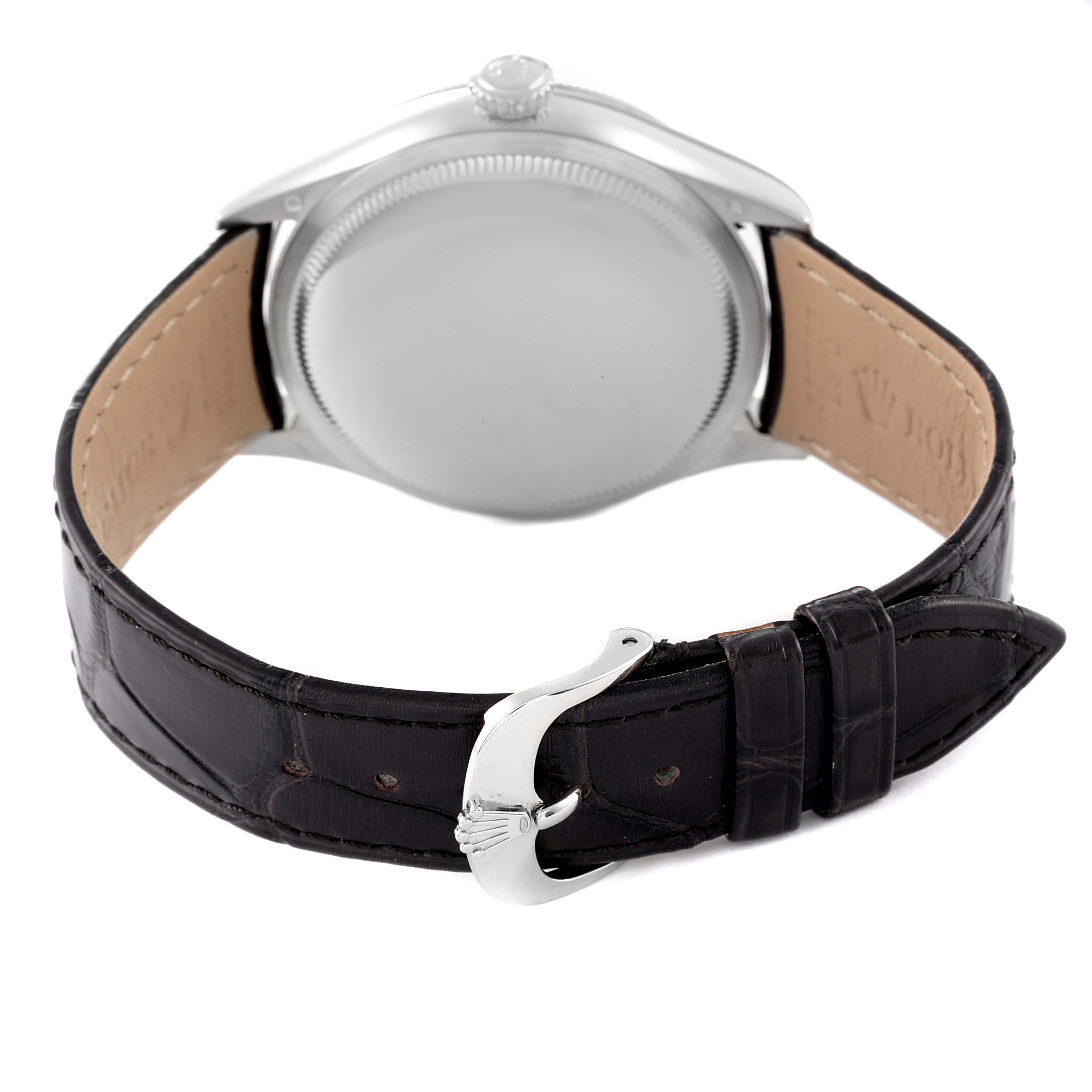 The image shows the back side of a Rolex Cellini 50609RBR Men's White Gold Black Dial 50609RBR Men's White Gold Black Dial watch with a closed case, leather strap, and clasp.