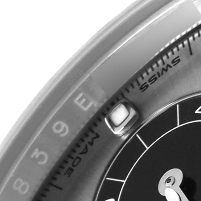 The image shows a close-up angle of the bezel and part of the dial of a Rolex Daytona 116519LN Men's White Gold Silver Dial 116519LN Men's White Gold Silver Dial watch.