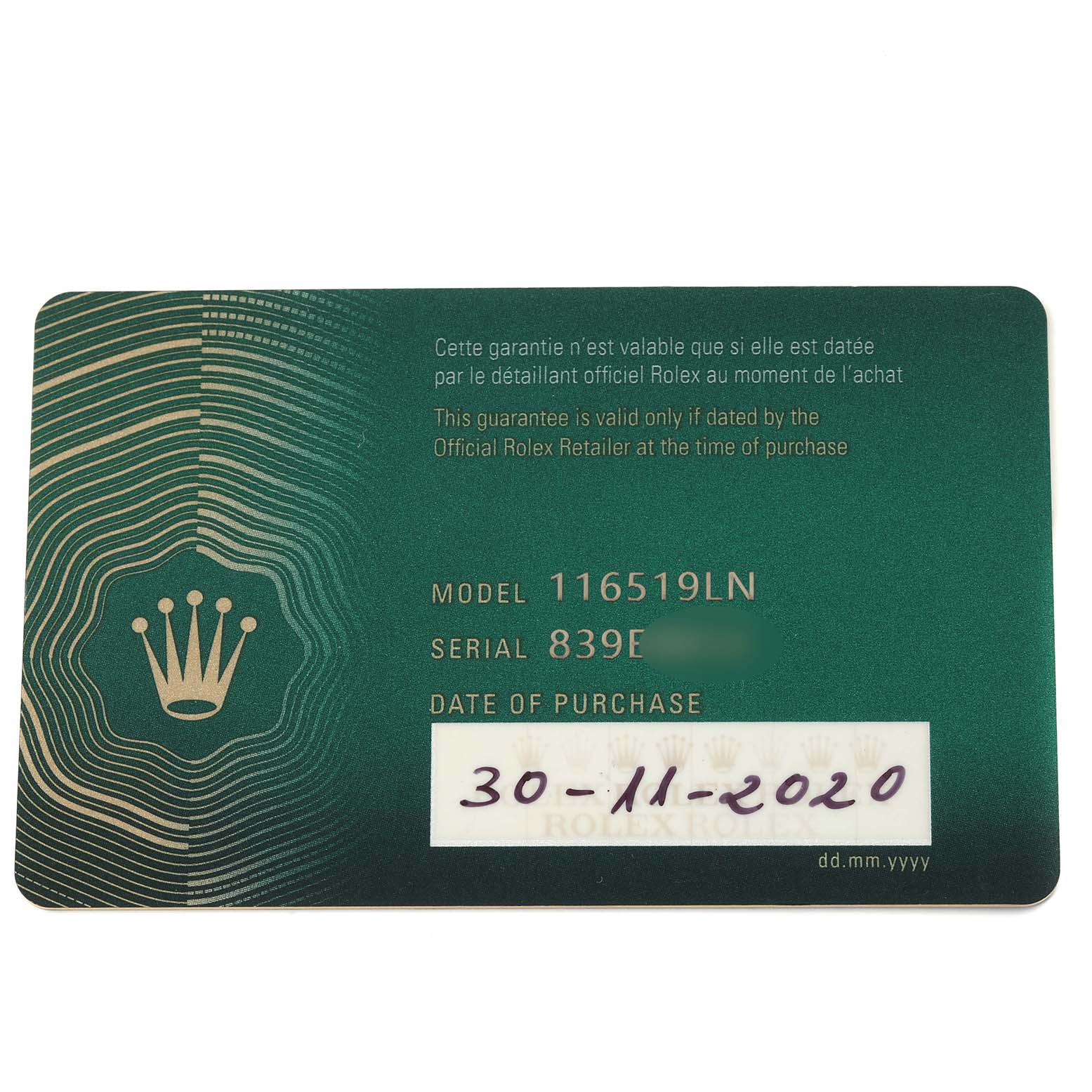 This image shows the warranty card for a Rolex Daytona 116519LN Men's White Gold Silver Dial 116519LN Men's White Gold Silver Dial model 116519LN, including the serial number and date of purchase.