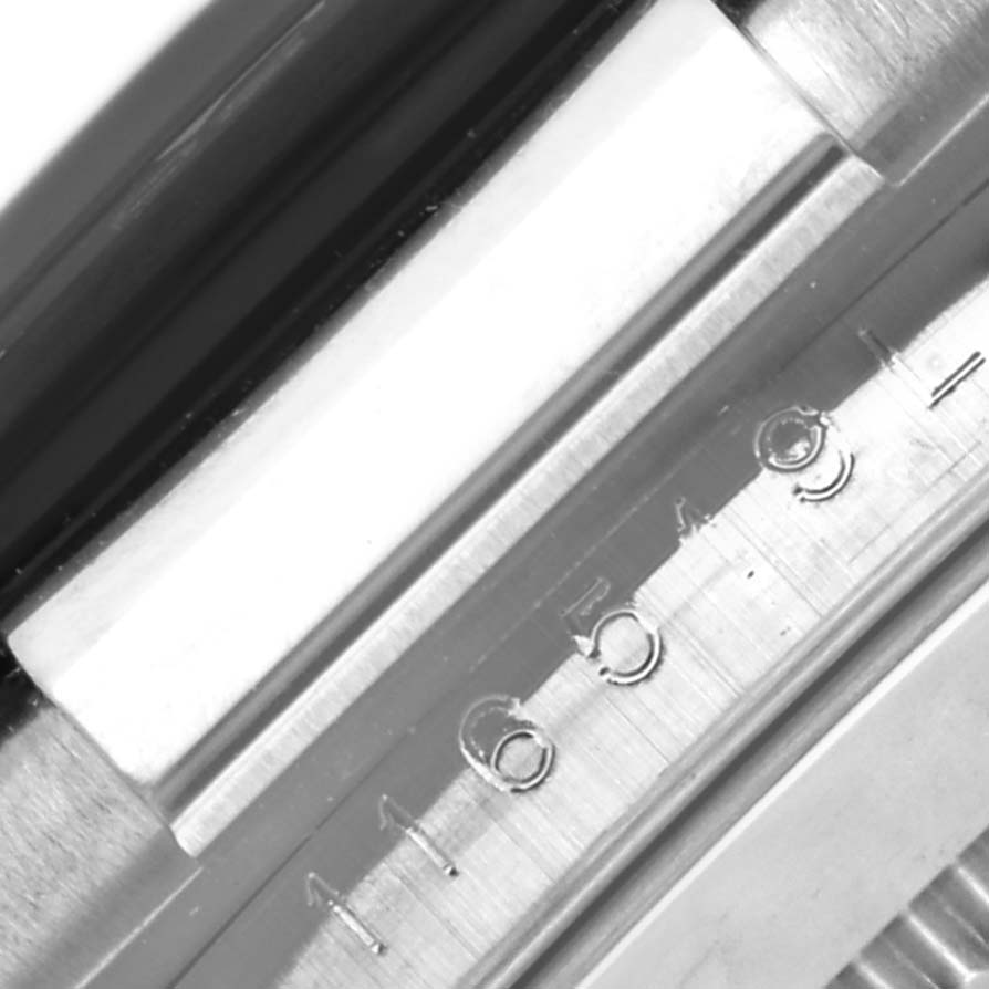 This image shows a close-up of the serial number engraving on the side case of a Rolex Daytona 116519LN Men's White Gold Silver Dial 116519LN Men's White Gold Silver Dial watch.
