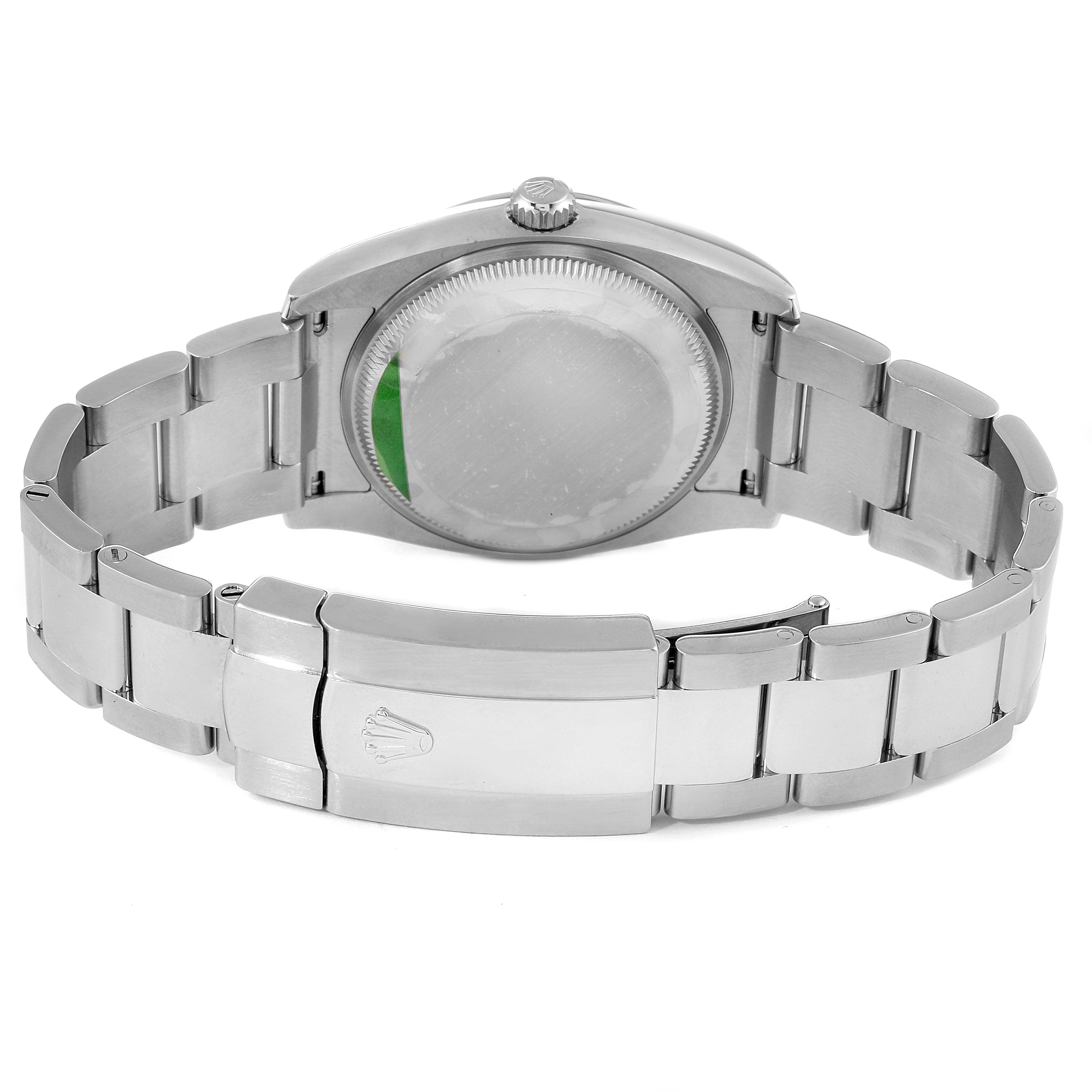 The image shows the back view of a Rolex Date 115200 Men's Stainless Steel Black Dial 115200 Men's Stainless Steel Black Dial model watch, highlighting its case back, clasp, and bracelet.