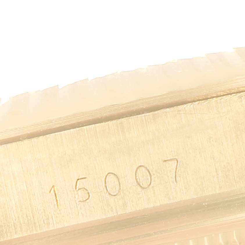 This is a close-up view of the side of a Rolex Vintage Collection 15007 Men's Yellow Gold Champagne Dial 15007 Men's Yellow Gold Champagne Dial model showing the engraved model number "15007".