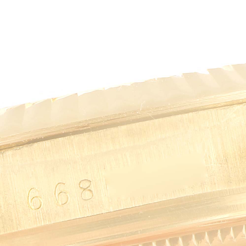This image shows a close-up angle of the side and bezel, with a partial serial number of a Rolex Vintage Collection 15007 Men's Yellow Gold Champagne Dial 15007 Men's Yellow Gold Champagne Dial watch.