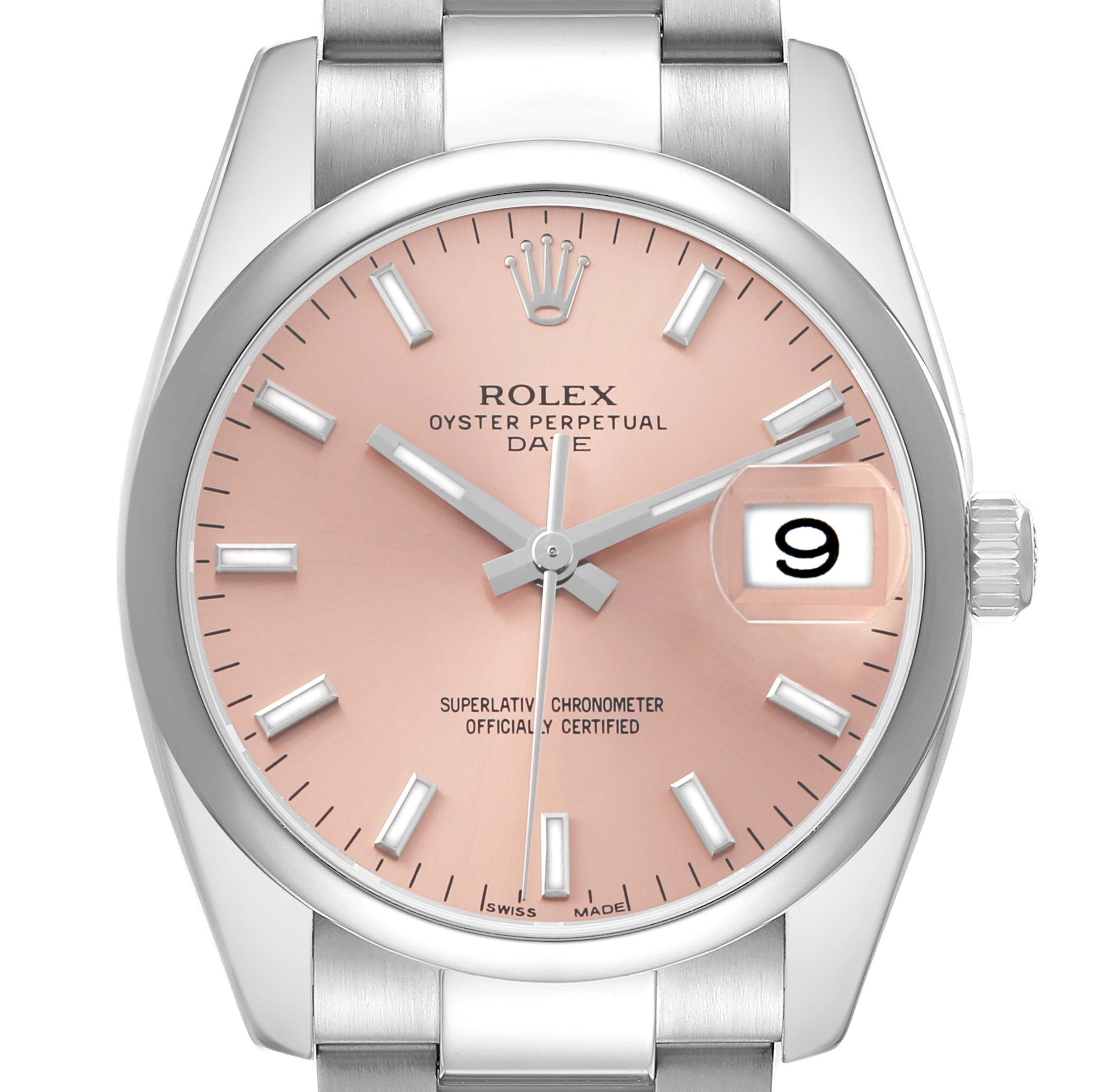 The Rolex Date 115200 Men's Stainless Steel Pink Dial model watch is shown from a front angle, displaying the dial, hands, crown, date window, and part of the bracelet.
