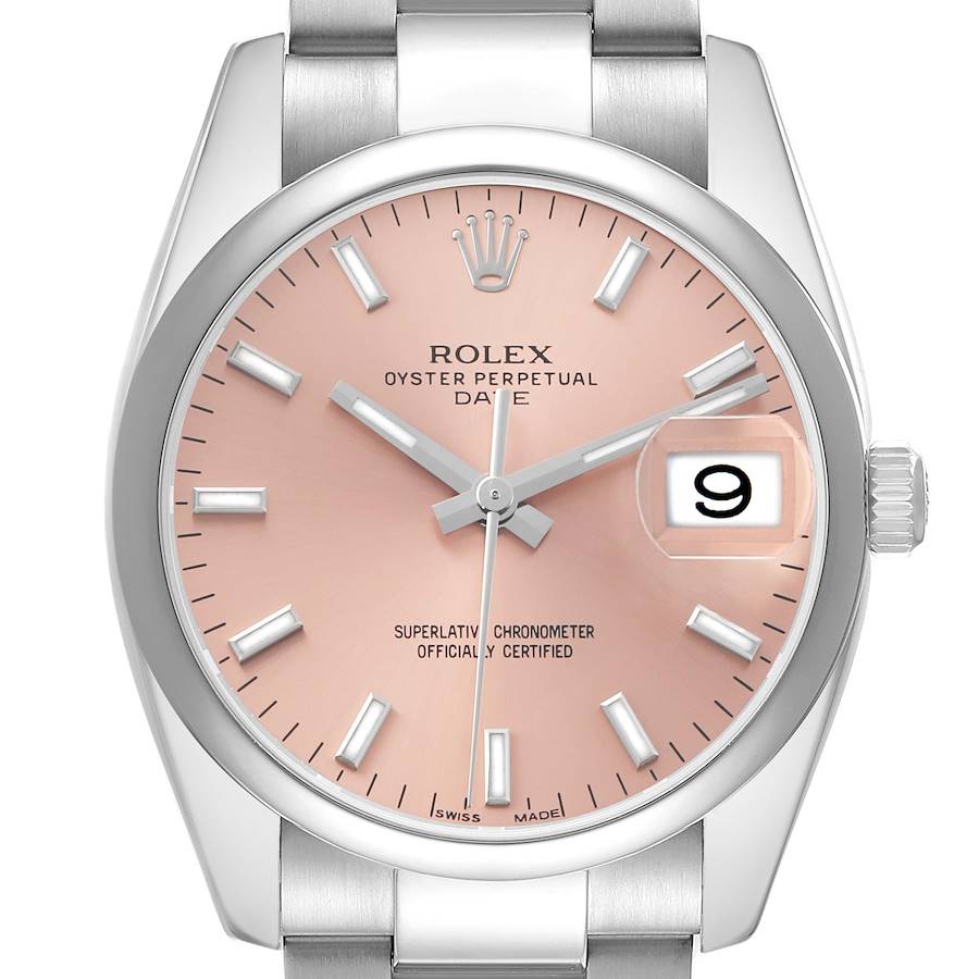 The Rolex Date 115200 Men's Stainless Steel Pink Dial model watch is shown from a front angle, displaying the dial, hands, crown, date window, and part of the bracelet.