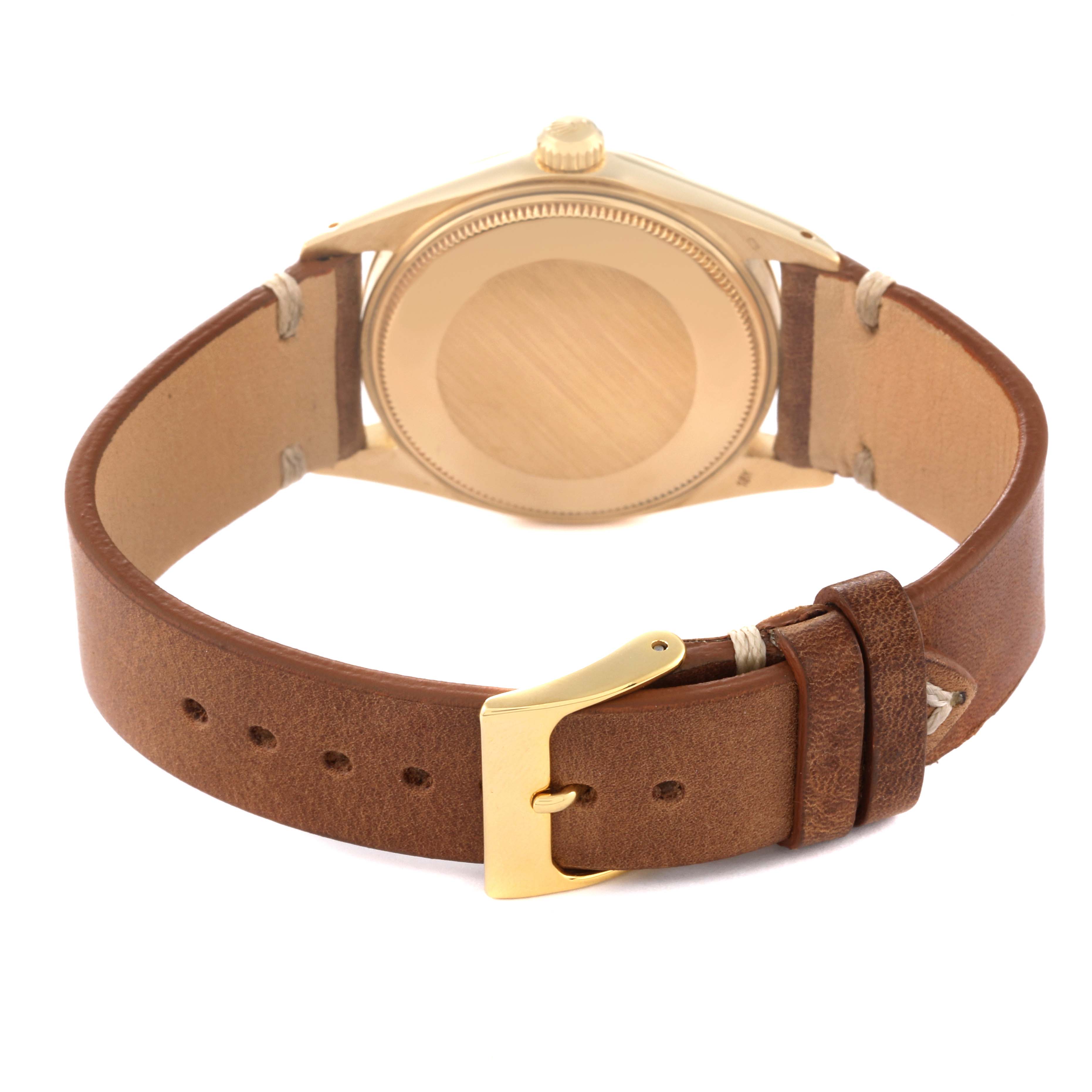 This image shows the back view of a Rolex Vintage Collection 1503 Men's Yellow Gold Champagne Dial 1503 Men's Yellow Gold Champagne Dial watch with a leather strap and gold buckle.