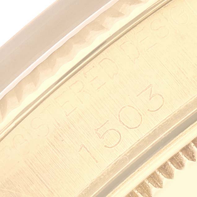 This close-up image shows the edge and part of the bezel on the Vintage Collection model by Rolex, with visible engravings.