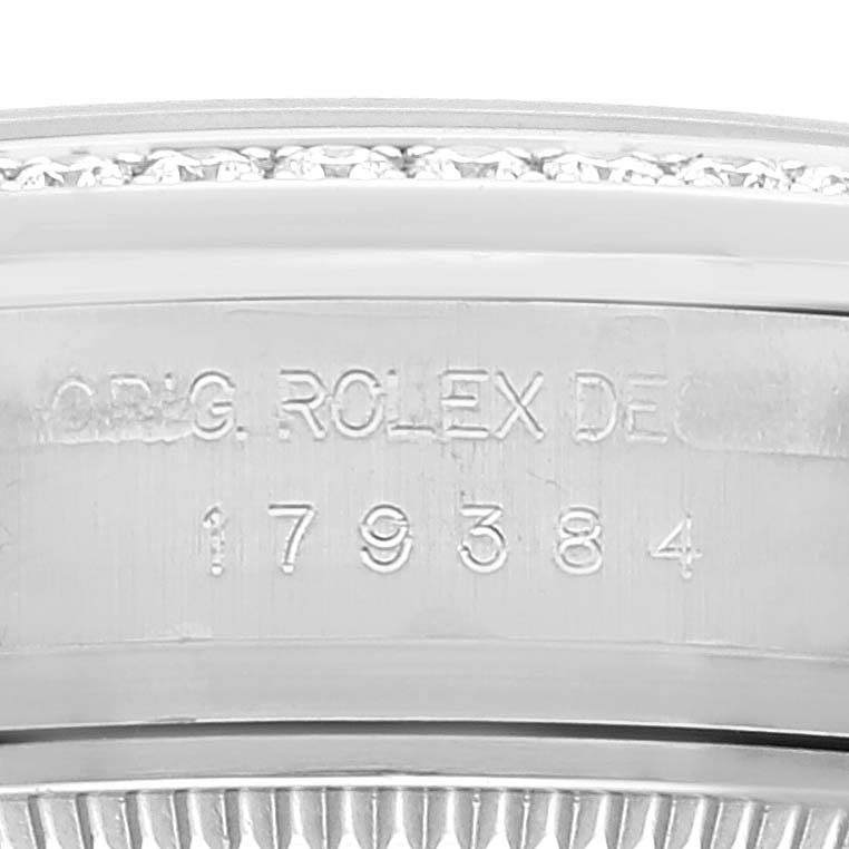 This image shows a close-up of the serial number engraving on the side of a Rolex Datejust 179384 Women's Stainless Steel Silver Dial 179384 Women's Stainless Steel Silver Dial watch case.