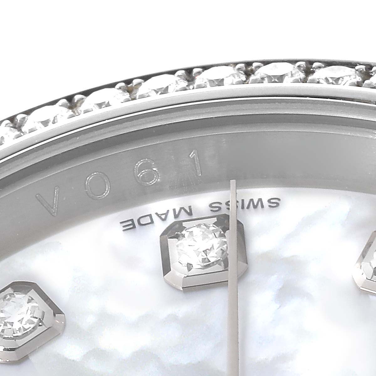 This image shows a close-up view of the bezel with diamonds, part of the dial, and hour markers of a Rolex Datejust 116189 Men's White Gold Mother of Pearl Dial 116189 Men's White Gold Mother of Pearl Dial watch.