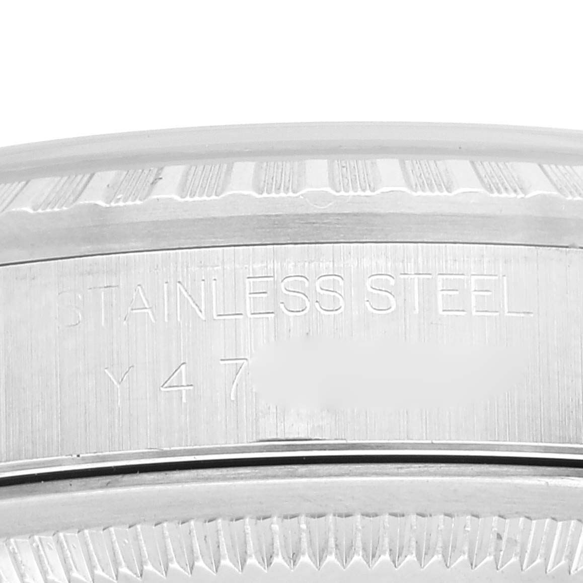 The image shows a close-up of the case back and fluted bezel of a Rolex Datejust 16220 Men's Stainless Steel White Dial 16220 Men's Stainless Steel White Dial watch, displaying the stainless steel material marking.