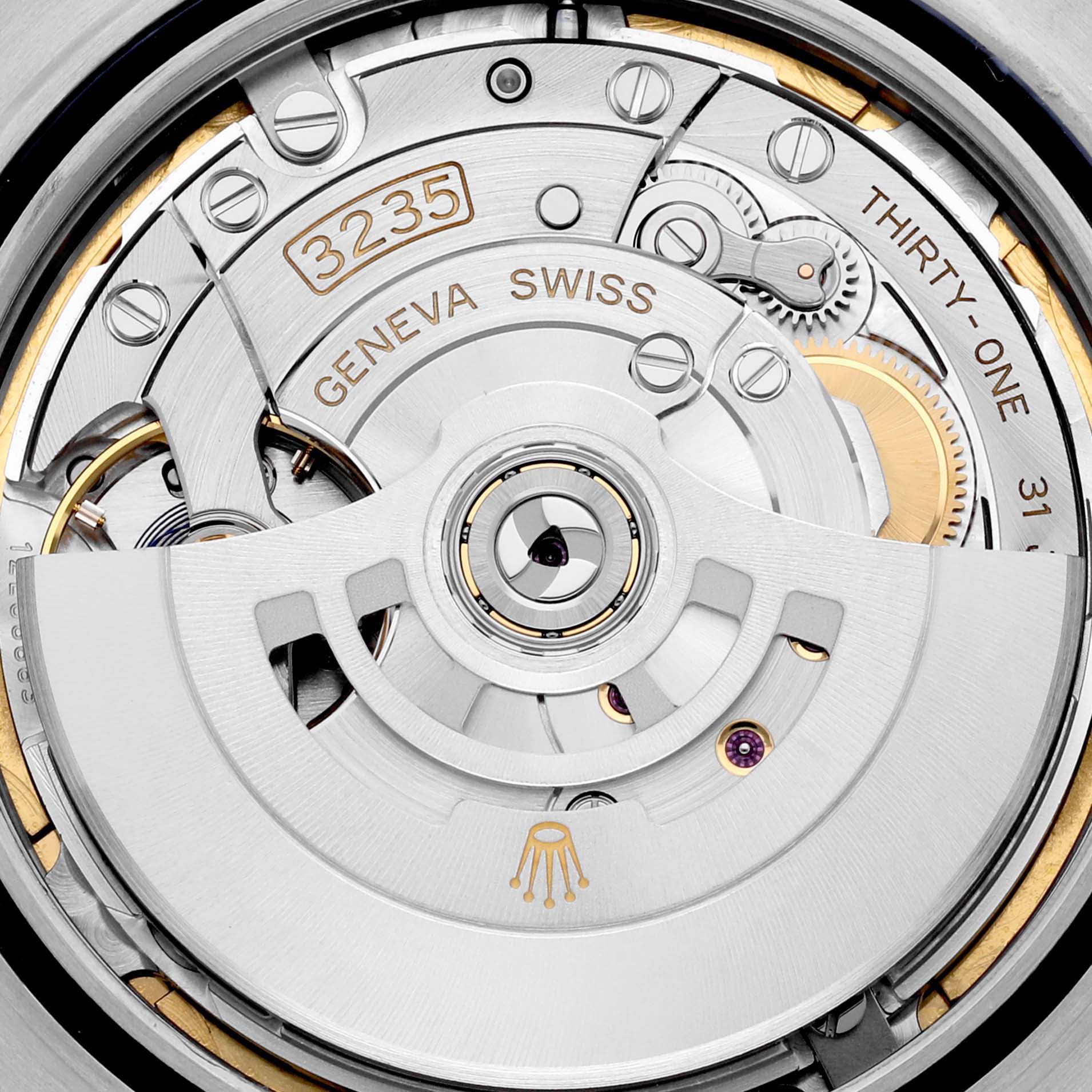 This image shows a close-up view of the movement mechanism of the Rolex Datejust 41 126300 Men
s Stainless Steel Blue Dial 126300 Men
s Stainless Steel Blue Dial, highlighting details like "3235" and "GENEVA SWISS".