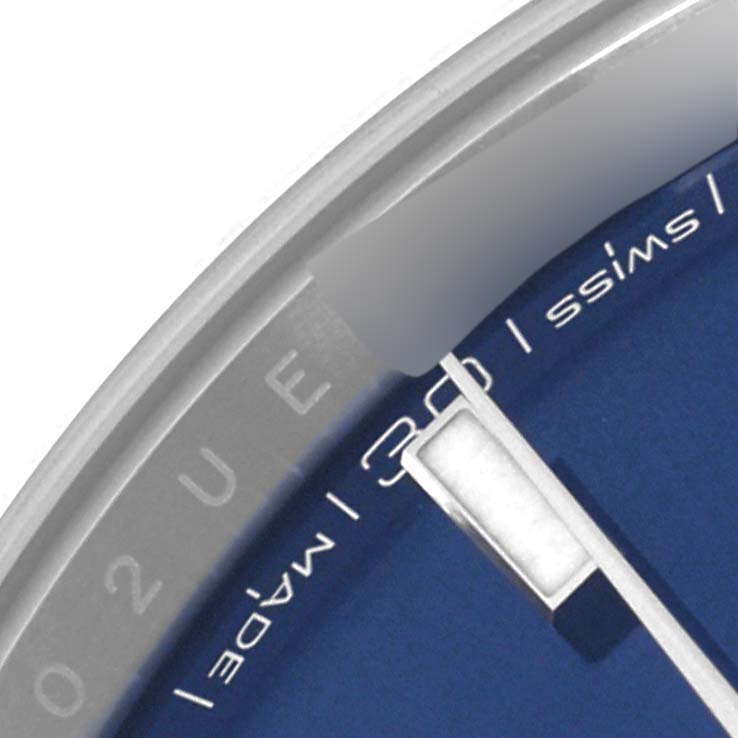This close-up image of a Rolex Datejust 41 126300 Men
s Stainless Steel Blue Dial 126300 Men
s Stainless Steel Blue Dial shows a portion of the dial, hour markers, and the minute hand.