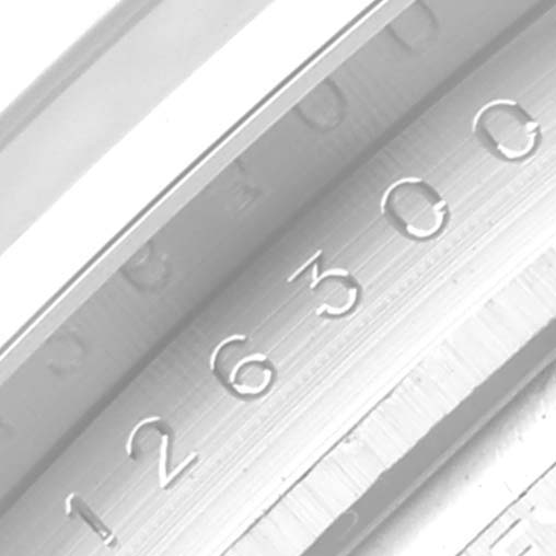 The image shows a close-up of the engraved inner bezel of the Rolex Datejust 41 126300 Men's Stainless Steel Green Dial, displaying the model number.