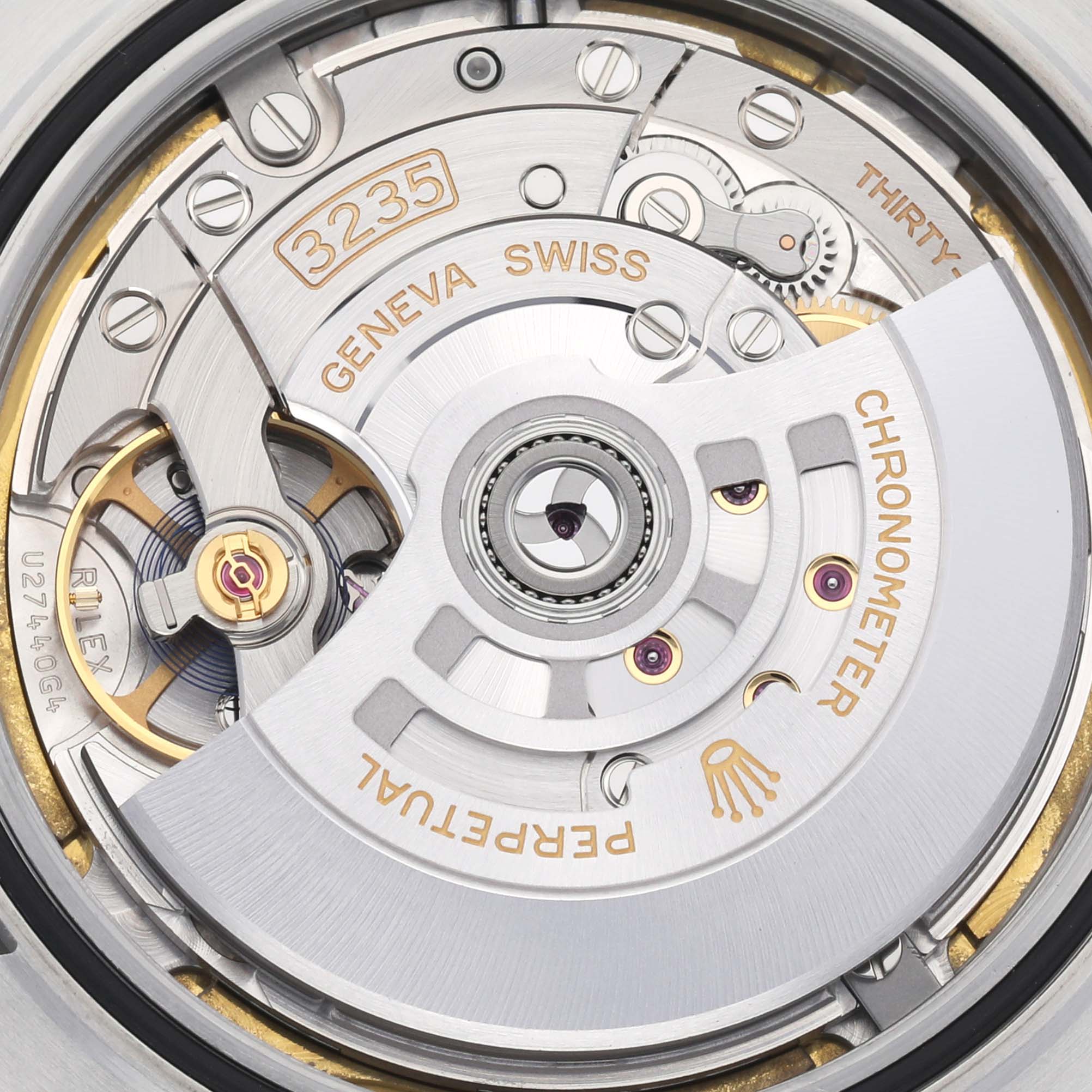 Close-up of the movement inside the Rolex Datejust 41 126334 Men's Stainless Steel White Dial 126334 Men's Stainless Steel White Dial, showing the rotor and intricate mechanisms.