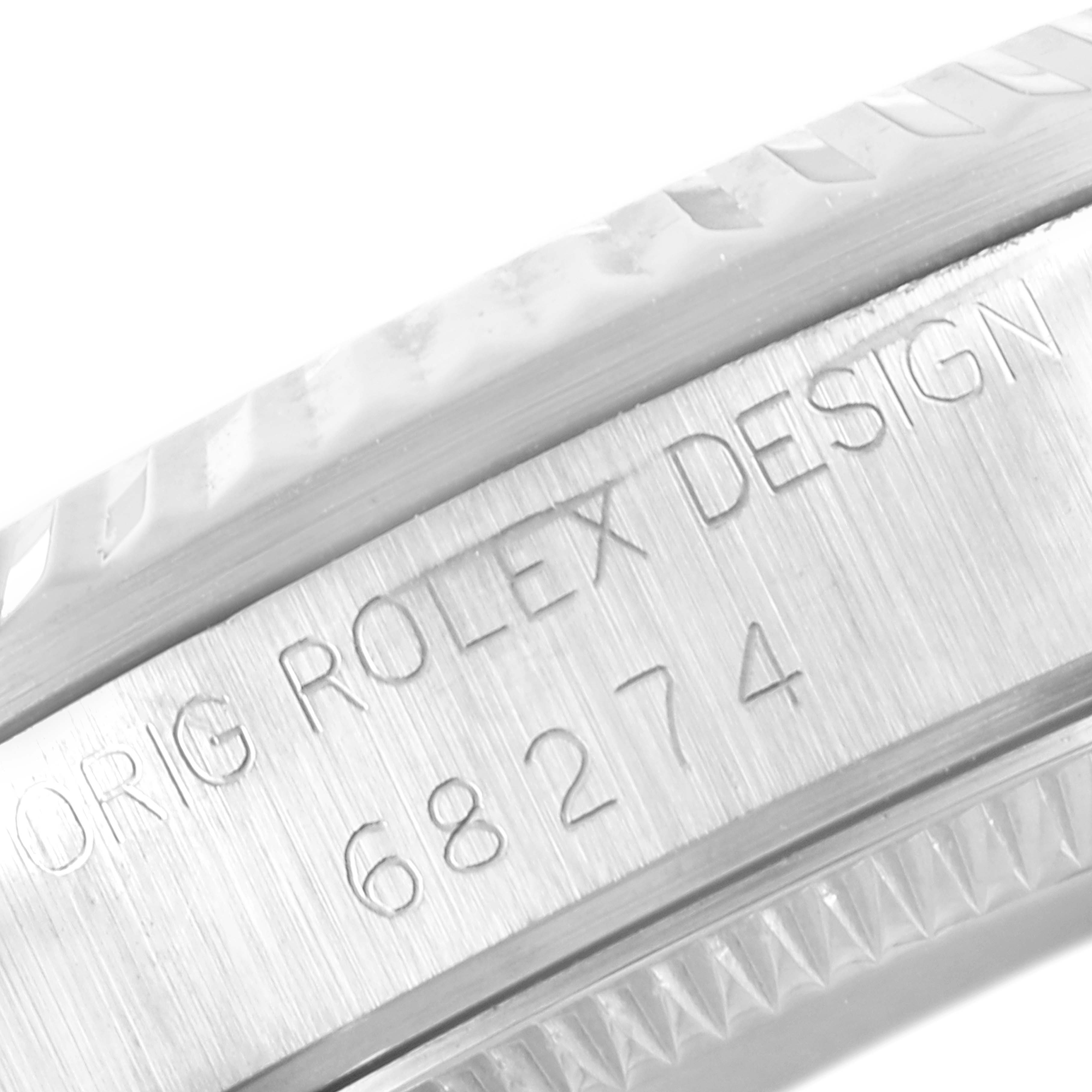 The image shows a close-up of the case side engraving on a Mid-Size Rolex model, displaying "ROLEX DESIGN" and the model number.