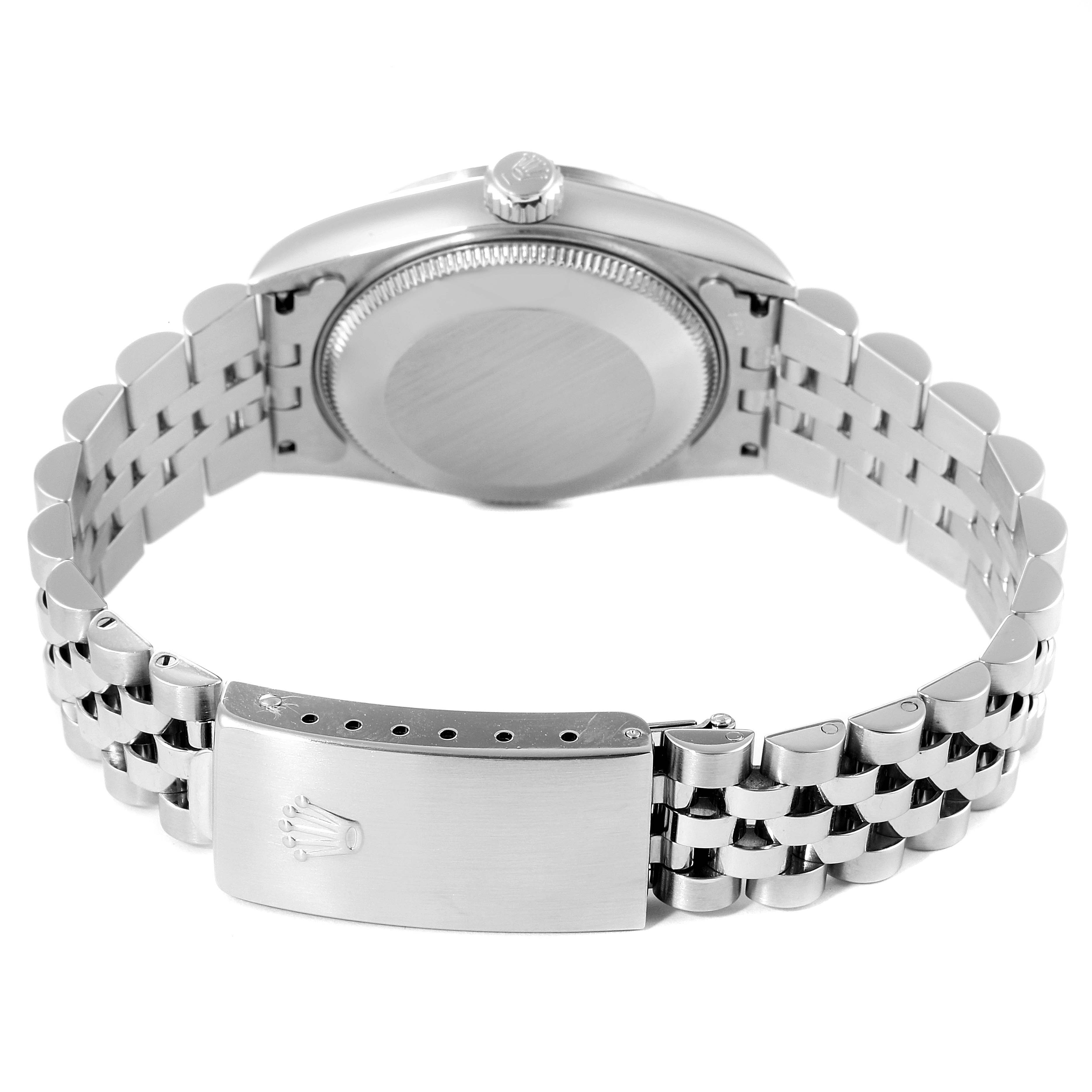 The image shows the back of a Rolex Mid-Size 78274 Women's Stainless Steel Silver Dial 78274 Women's Stainless Steel Silver Dial watch and its bracelet with the clasp opened.