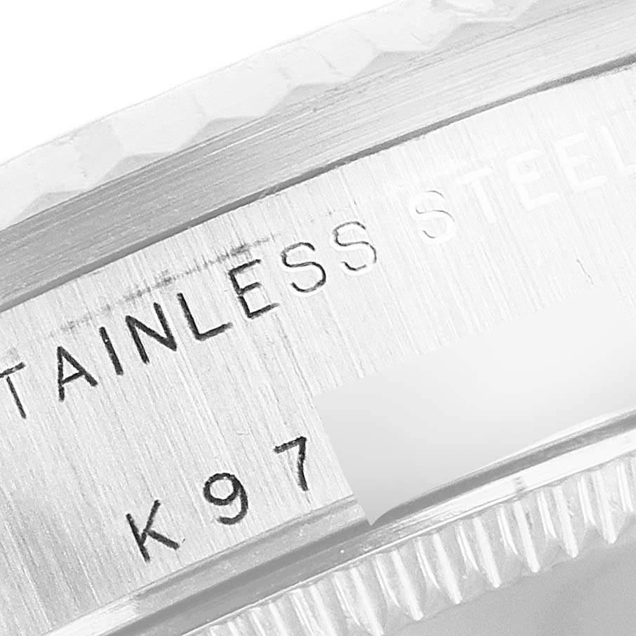 Close-up angle of a Rolex Mid-Size 78274 Women's Stainless Steel Silver Dial 78274 Women's Stainless Steel Silver Dial watch showing the stainless steel inscription and part of the bezel.