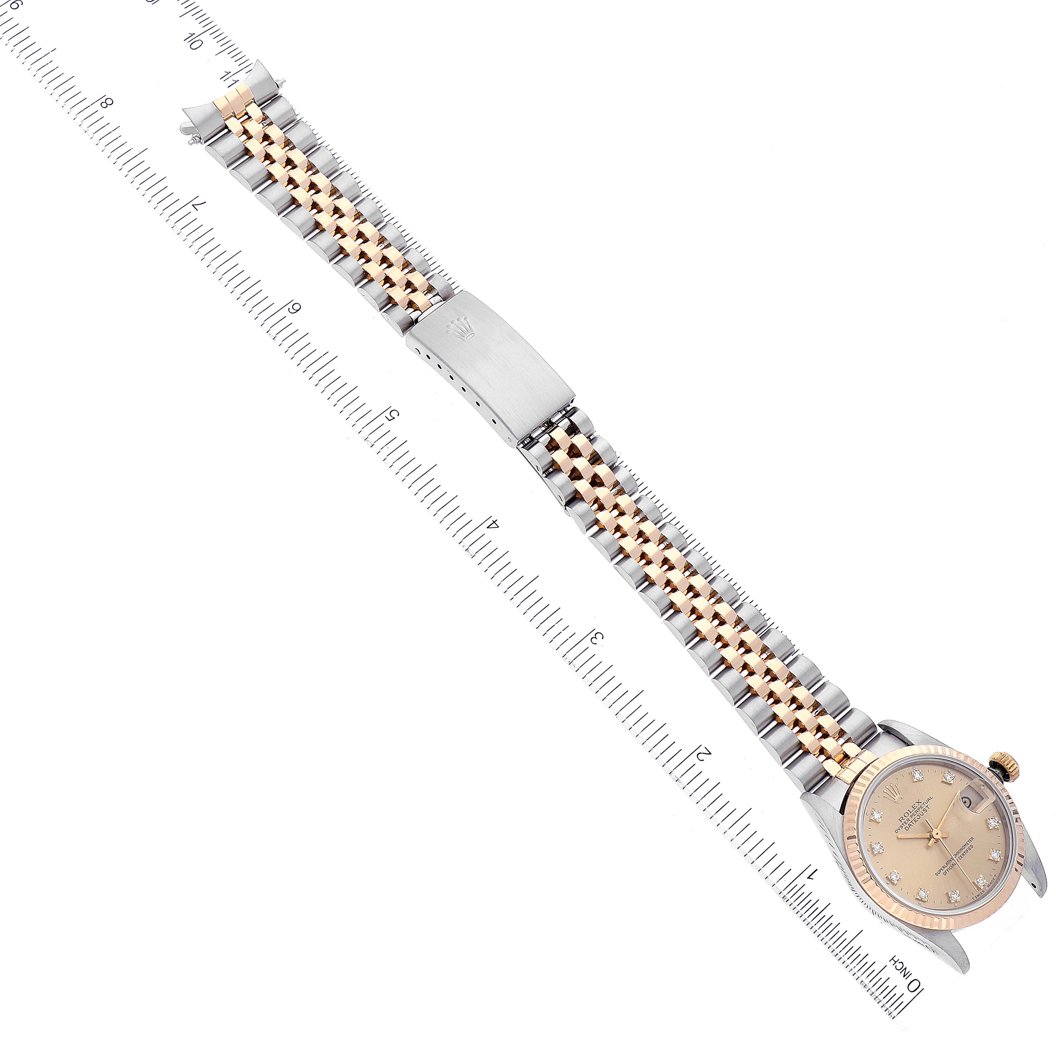The image shows a Rolex Mid-Size 68273 Women's Steel and Gold (two tone) Champagne Dial 68273 Women's Steel and Gold (two tone) Champagne Dial watch laid flat, displaying the bracelet, clasp, and dial from a top-down angle alongside a ruler.
