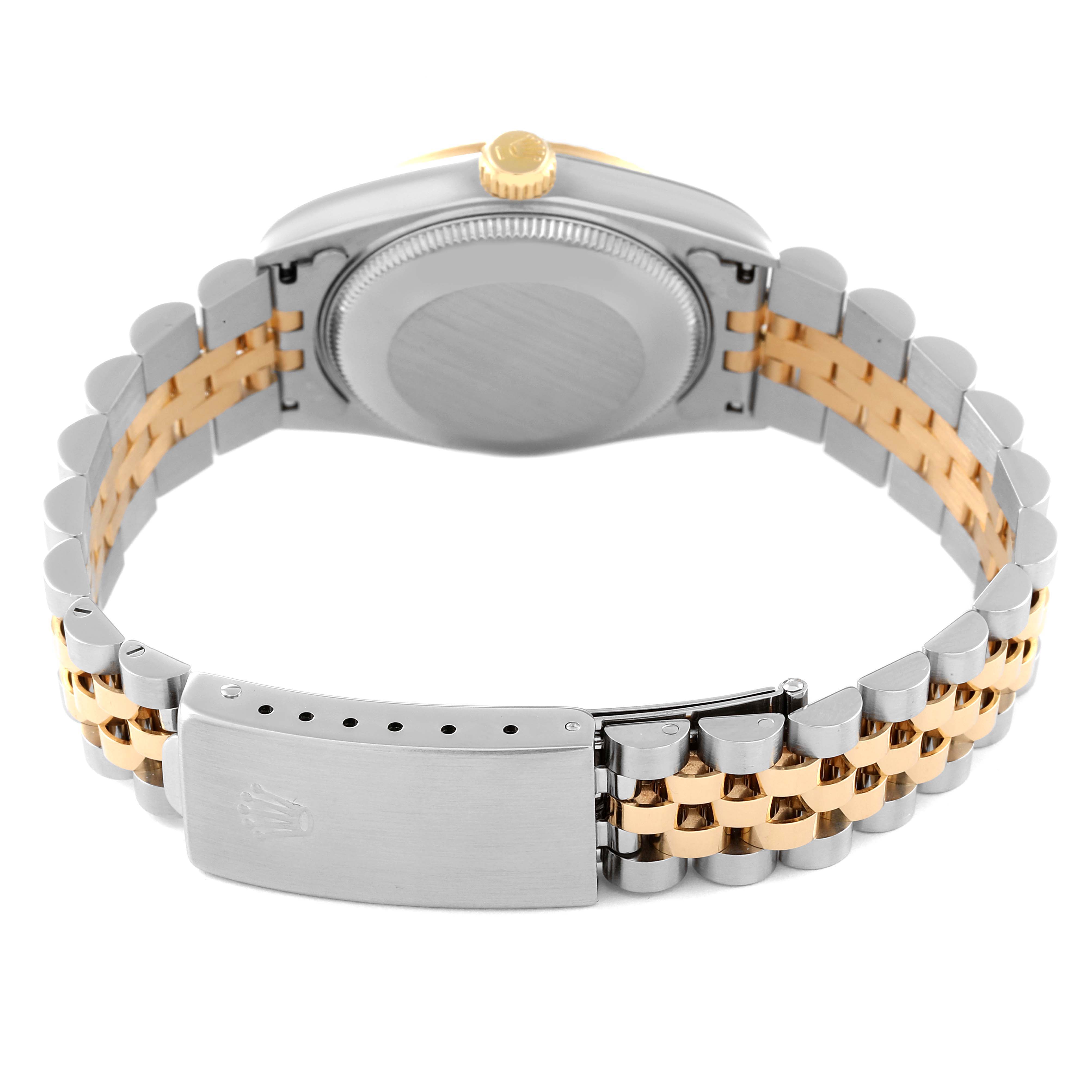 This image shows the backside of a Rolex Mid-Size 68273 Women's Steel and Gold (two tone) Champagne Dial 68273 Women's Steel and Gold (two tone) Champagne Dial watch, highlighting the metal case back and two-tone Jubilee bracelet with clasp.