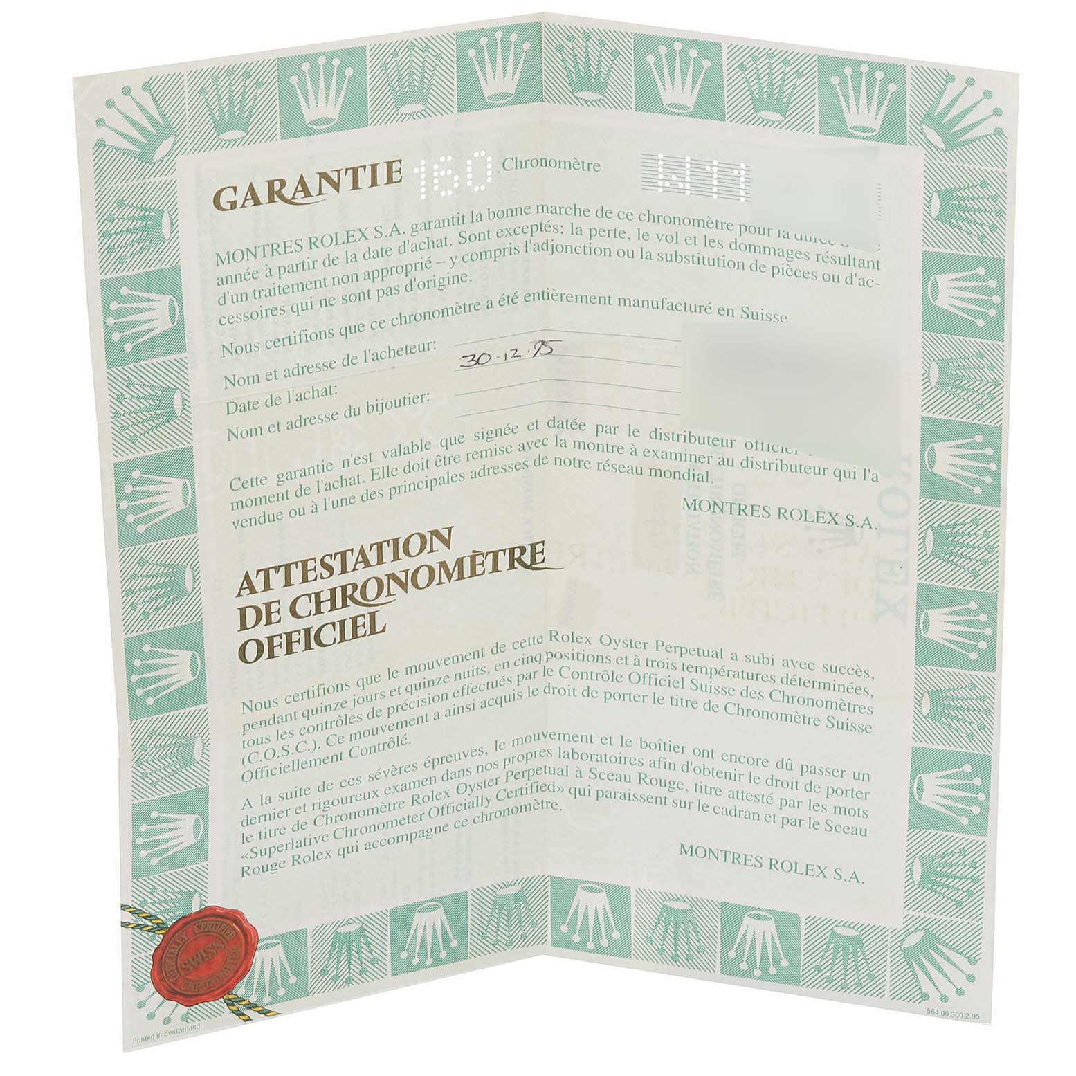 This image shows an official chronometer certificate for a mid-size Rolex watch, displayed partially open.