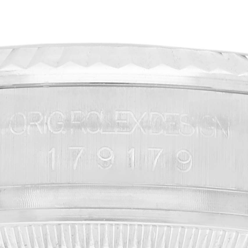 This image shows a close-up view of the side engraving on the case of a Rolex President 179179 Women's White Gold Brown Dial 179179 Women's White Gold Brown Dial model watch.
