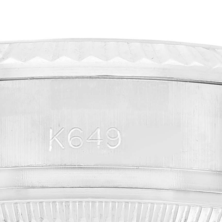 This close-up image shows the bezel and case side of a Rolex President 179179 Women's White Gold Brown Dial 179179 Women's White Gold Brown Dial model, featuring the serial number "K649."