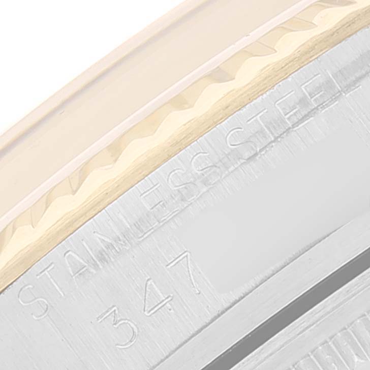 This close-up image shows the engraved text and part of the bezel of the Rolex Vintage Collection 1601 Men's Steel and Gold (two tone) Silver Dial 1601 Men's Steel and Gold (two tone) Silver Dial model.