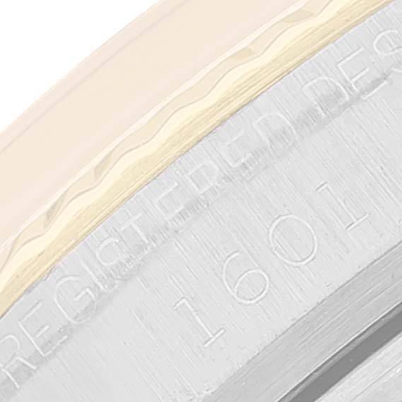 This image shows a close-up of the Rolex Vintage Collection 1601 Men's Steel and Gold (two tone) Silver Dial 1601 Men's Steel and Gold (two tone) Silver Dial model 1601 case back inscription.