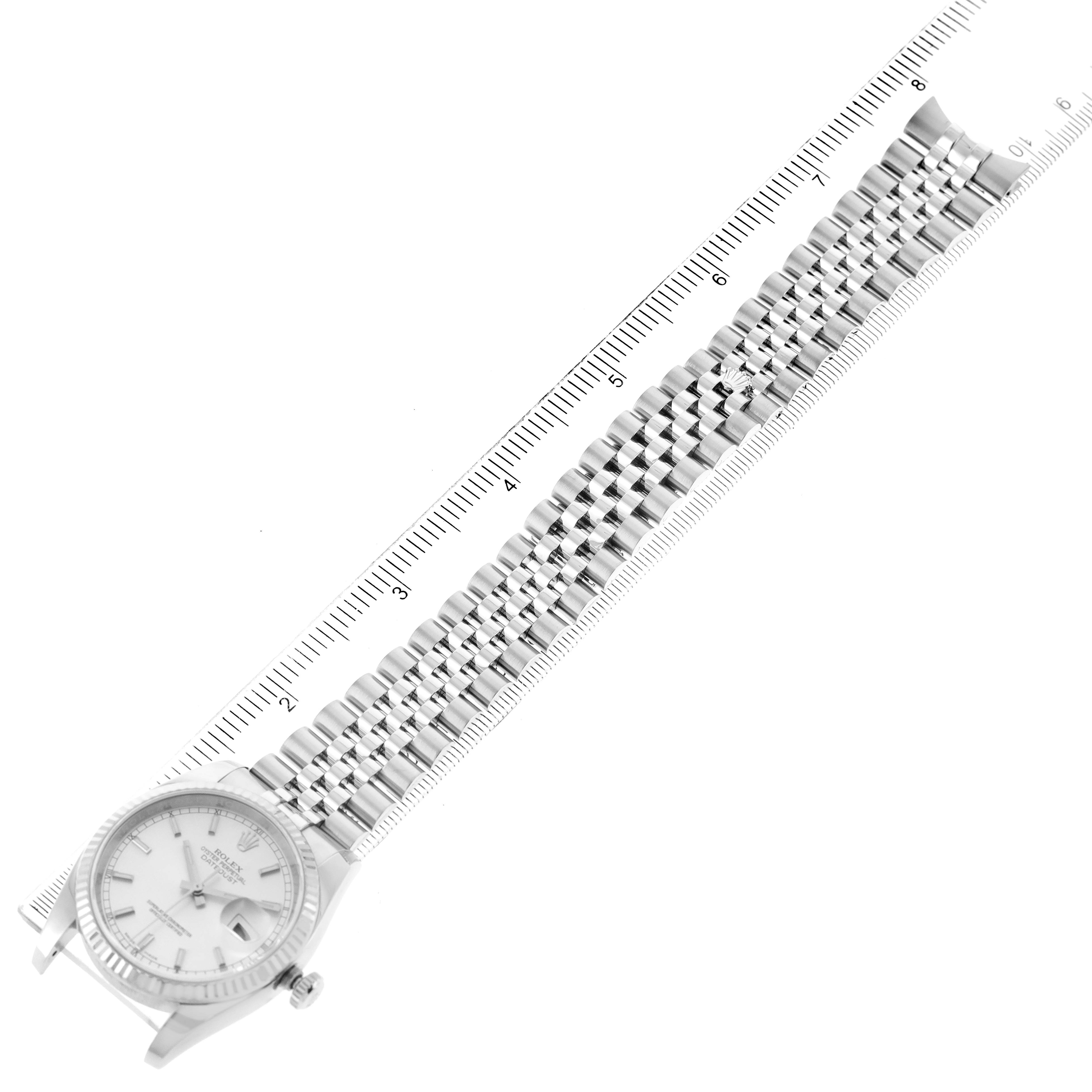 The image shows a top-down view of a Rolex Datejust 116234 Men's Stainless Steel Silver Dial 116234 Men's Stainless Steel Silver Dial watch lying flat, with its bracelet extended and adjacent to a ruler for scale.