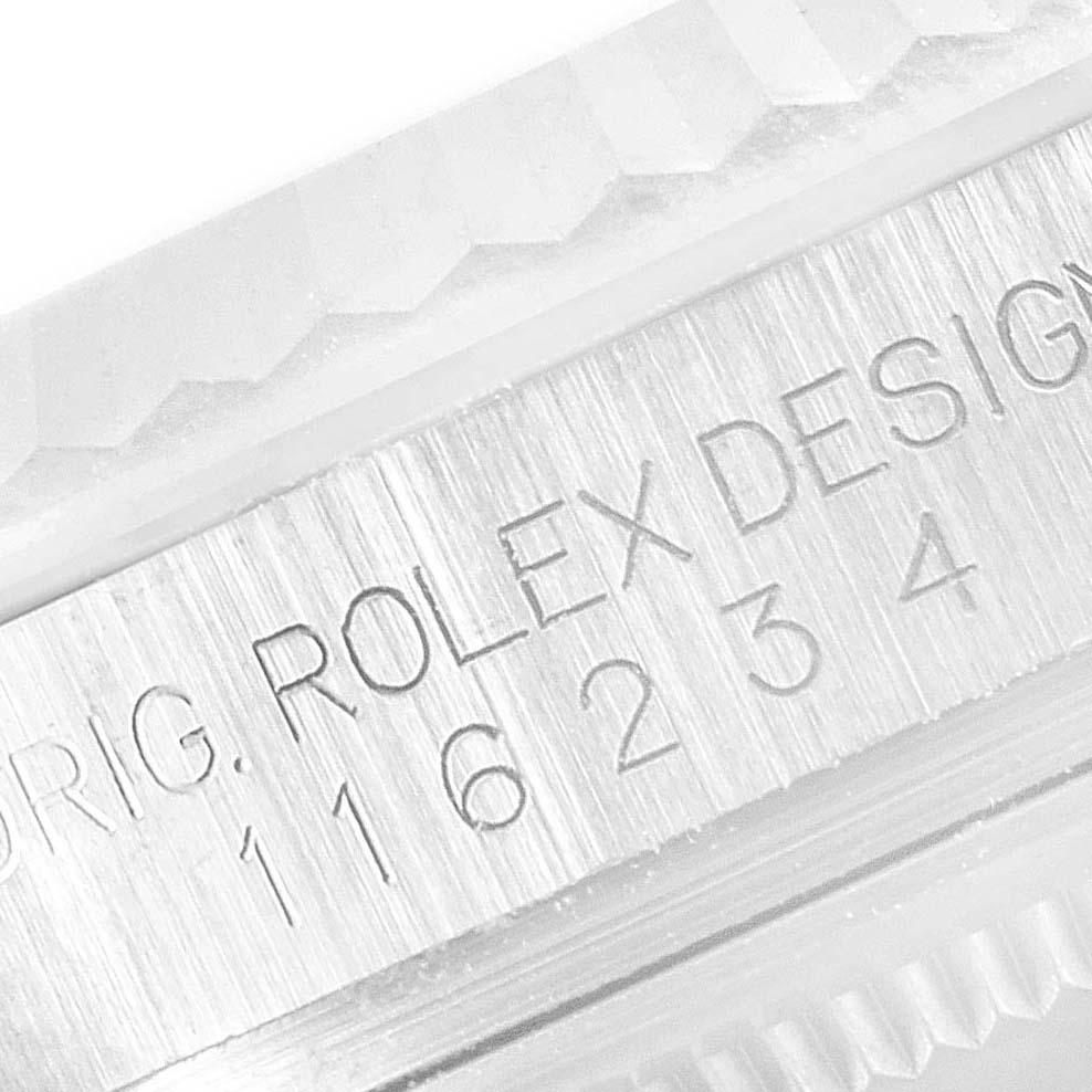 A close-up image of the Rolex Datejust 116234 Men's Stainless Steel Silver Dial 116234 Men's Stainless Steel Silver Dial model showcases the engraved "Rolex Design" and model number on the case side.