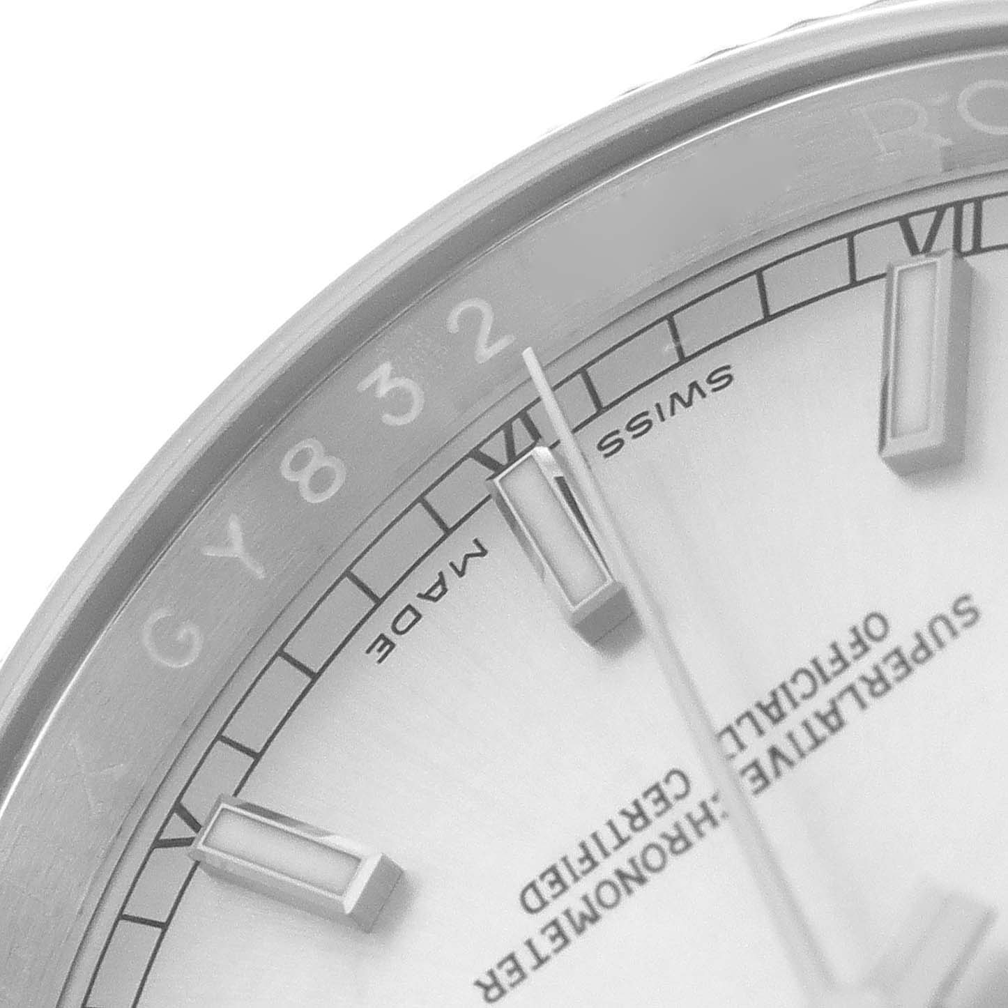 The image shows a close-up of a Rolex Datejust 116234 Men's Stainless Steel Silver Dial 116234 Men's Stainless Steel Silver Dial watch dial, with focus on the markers, minute hand, and parts of the bezel.