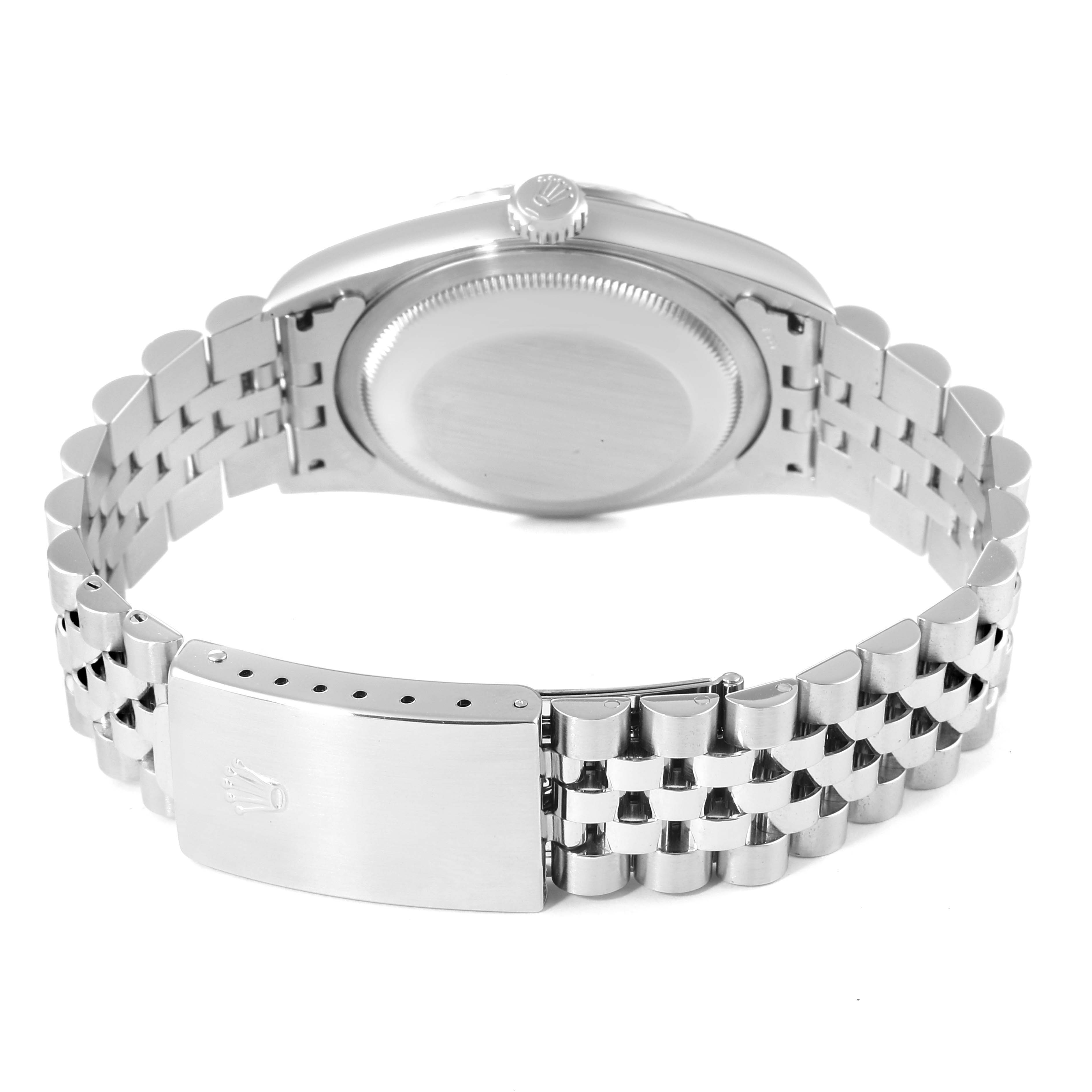 The image shows the back of a Rolex Datejust 16234 Men's Stainless Steel Silver Dial 16234 Men's Stainless Steel Silver Dial watch and its stainless steel bracelet.