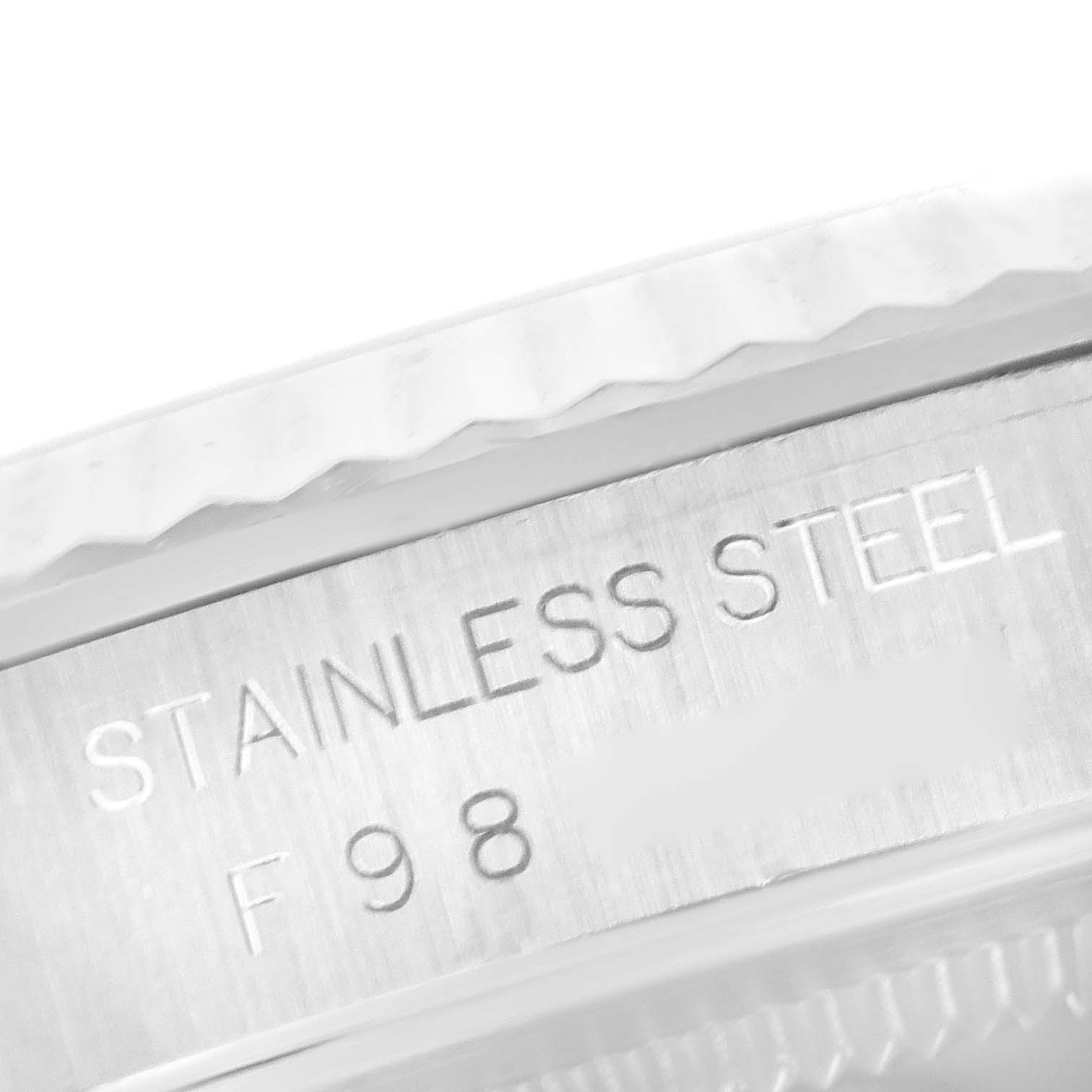 This close-up image shows the edge of the bezel and case of a Rolex Datejust 16234 Men's Stainless Steel Silver Dial 16234 Men's Stainless Steel Silver Dial watch, displaying "STAINLESS STEEL" engraving.