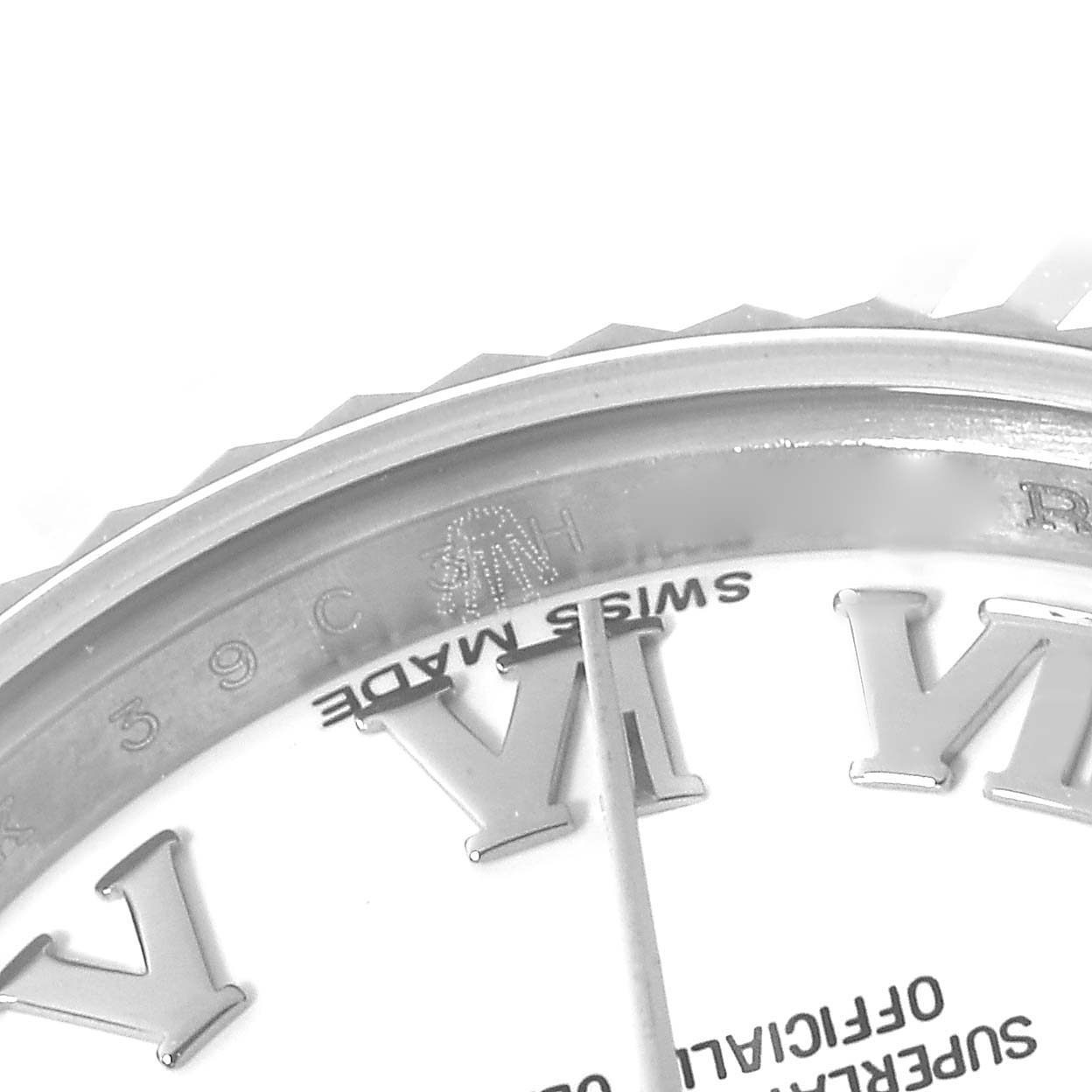 This image shows a close-up of the dial and fluted bezel of a Rolex Datejust 179174 Women's Stainless Steel White Dial 179174 Women's Stainless Steel White Dial watch, highlighting the Roman numerals and "Swiss Made" text.