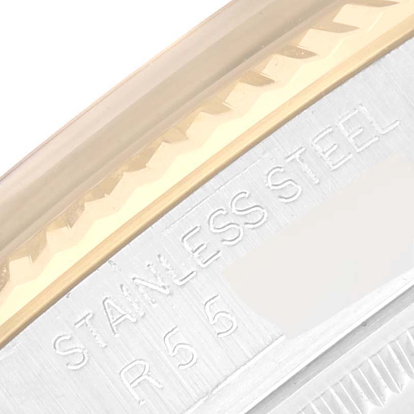 The image shows a close-up of the side engraving on a Rolex Datejust 16013 Men's Steel and Gold (two tone) Champagne Dial 16013 Men's Steel and Gold (two tone) Champagne Dial watch case, including "STAINLESS STEEL" text.