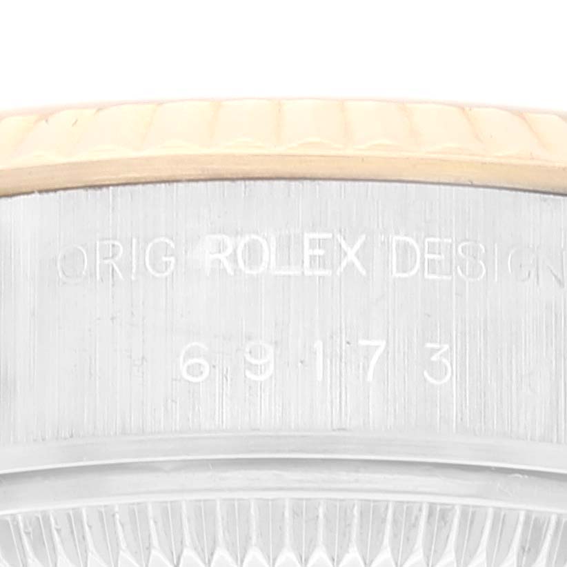This image shows a close-up of the serial number engraving on the case of a Rolex Datejust 69173 Women's Steel and Gold (two tone) Champagne Dial 69173 Women's Steel and Gold (two tone) Champagne Dial watch.