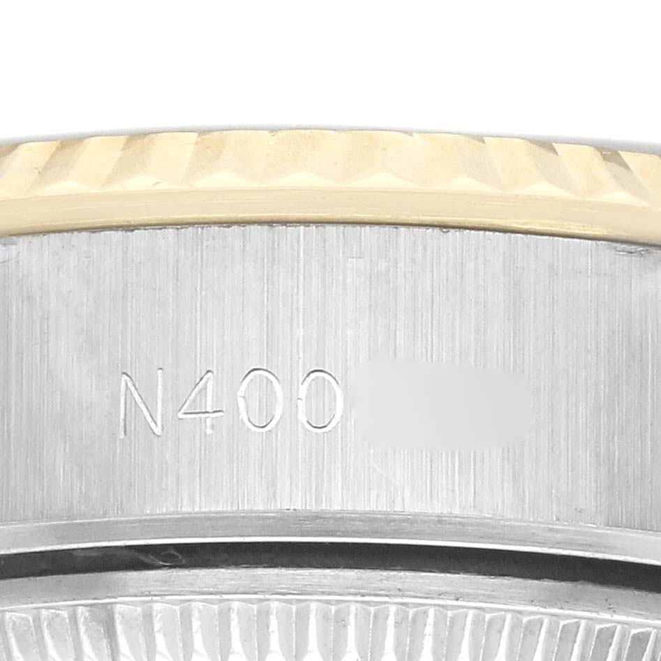 This image shows a close-up of the case sides displaying part of the model number of a Rolex Datejust 69173 Women
s Steel and Gold (two tone) Champagne Dial 69173 Women
s Steel and Gold (two tone) Champagne Dial.