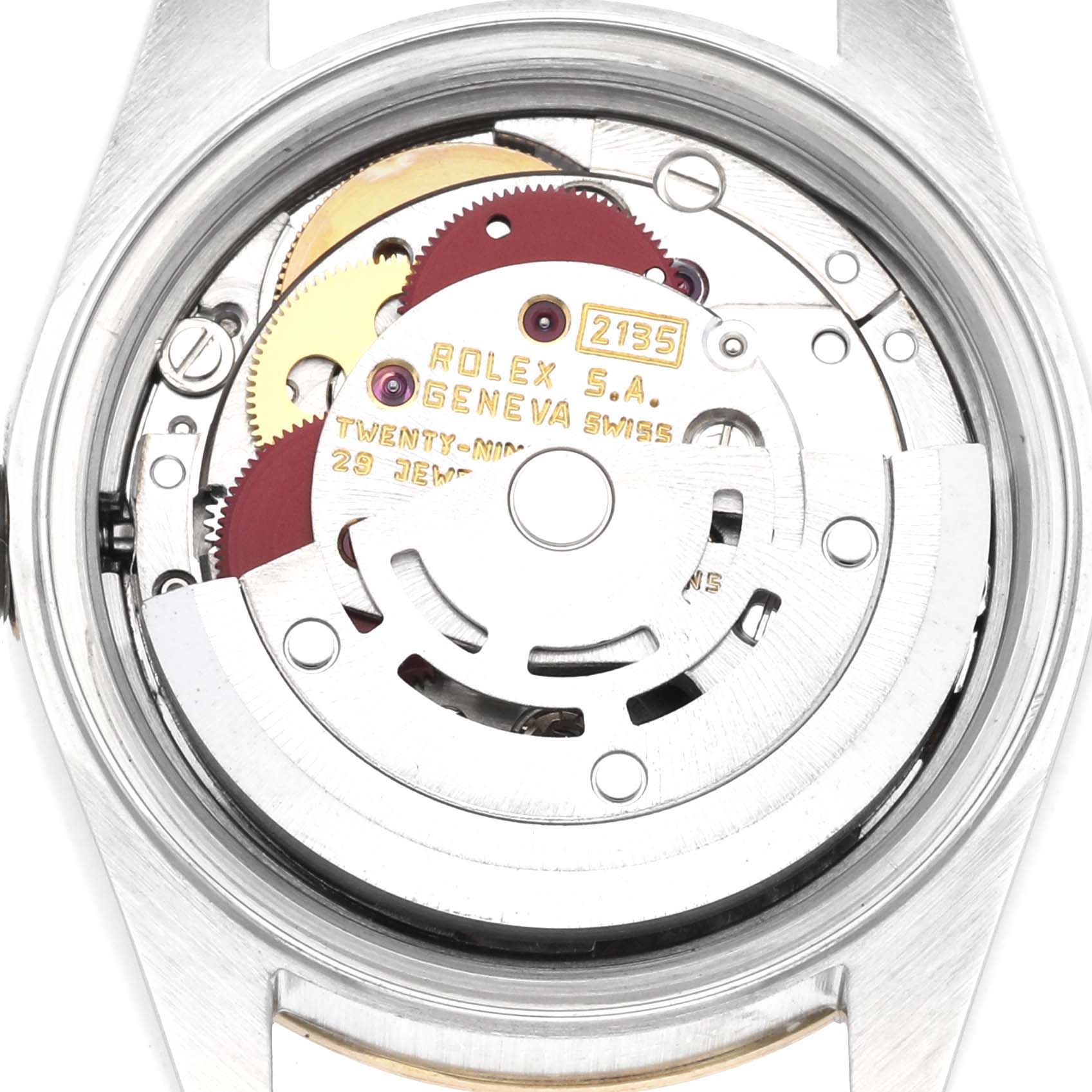 This image shows the inner mechanical movement of a Rolex Datejust 69173 Women
s Steel and Gold (two tone) Champagne Dial 69173 Women
s Steel and Gold (two tone) Champagne Dial watch from a back angle, highlighting gears and inscriptions.